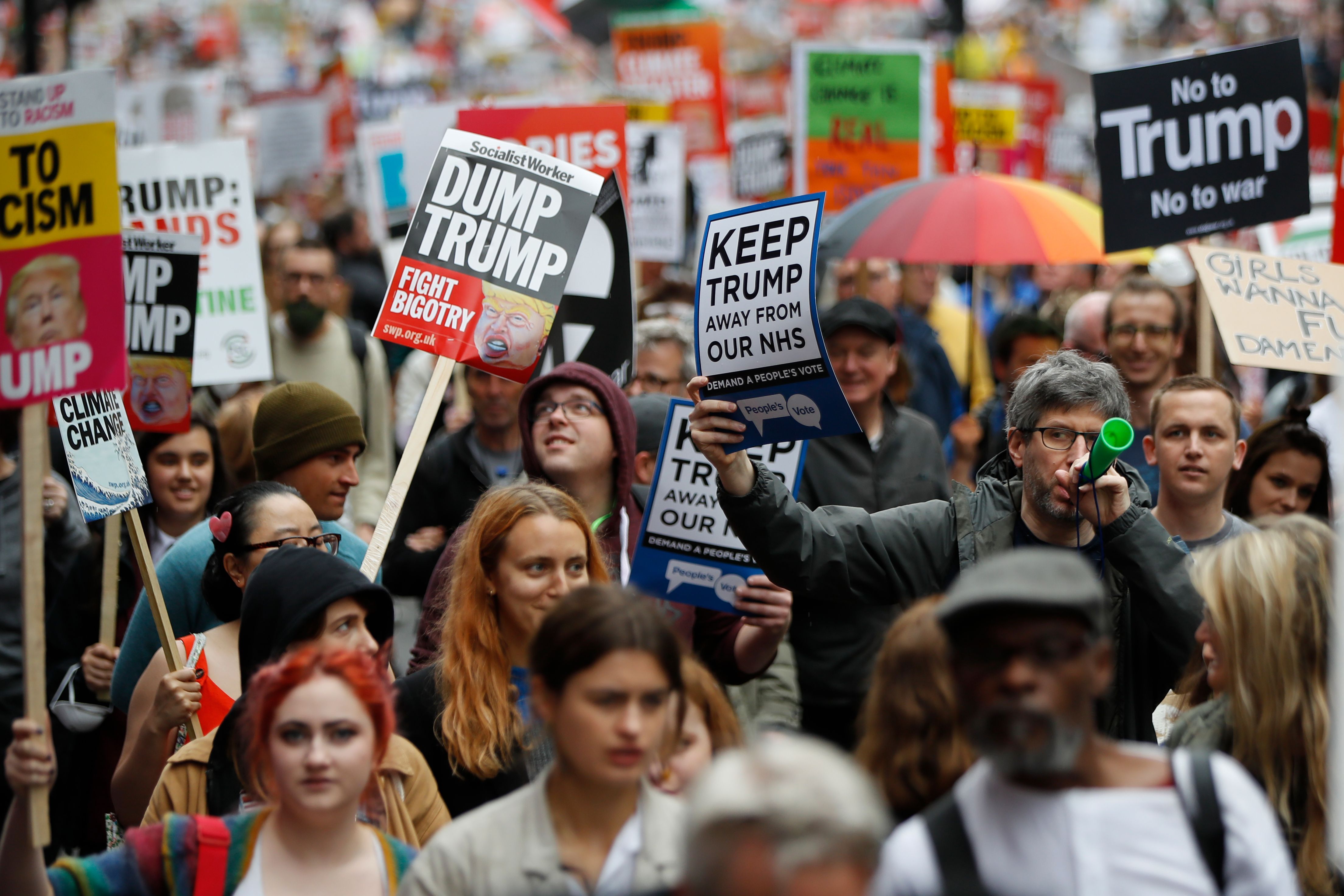 Demonstrators protest against the visit of US President Donald Trump along whitehall in London on June 4, 2019.