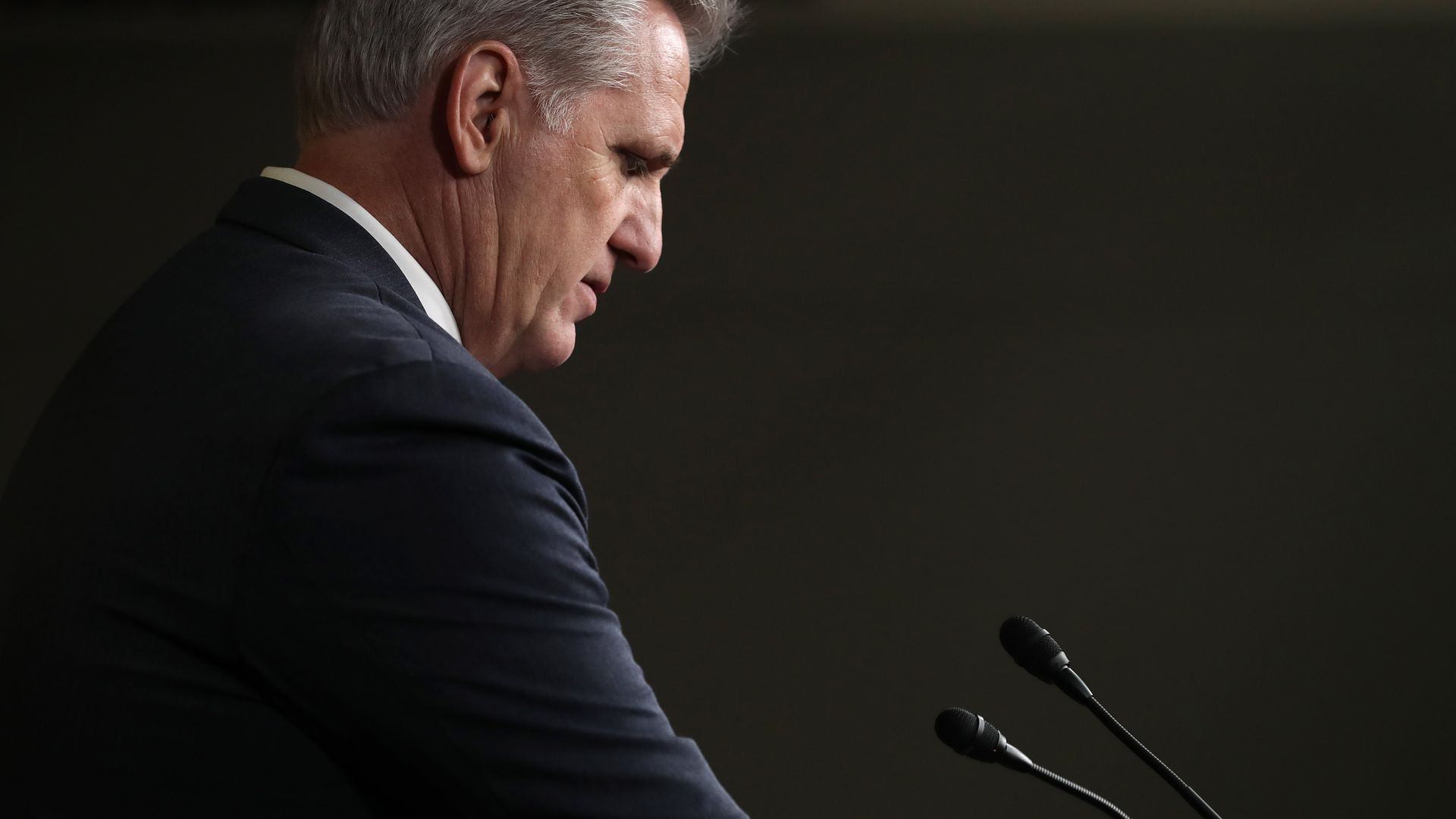 A side shot of Kevin McCarthy looking down