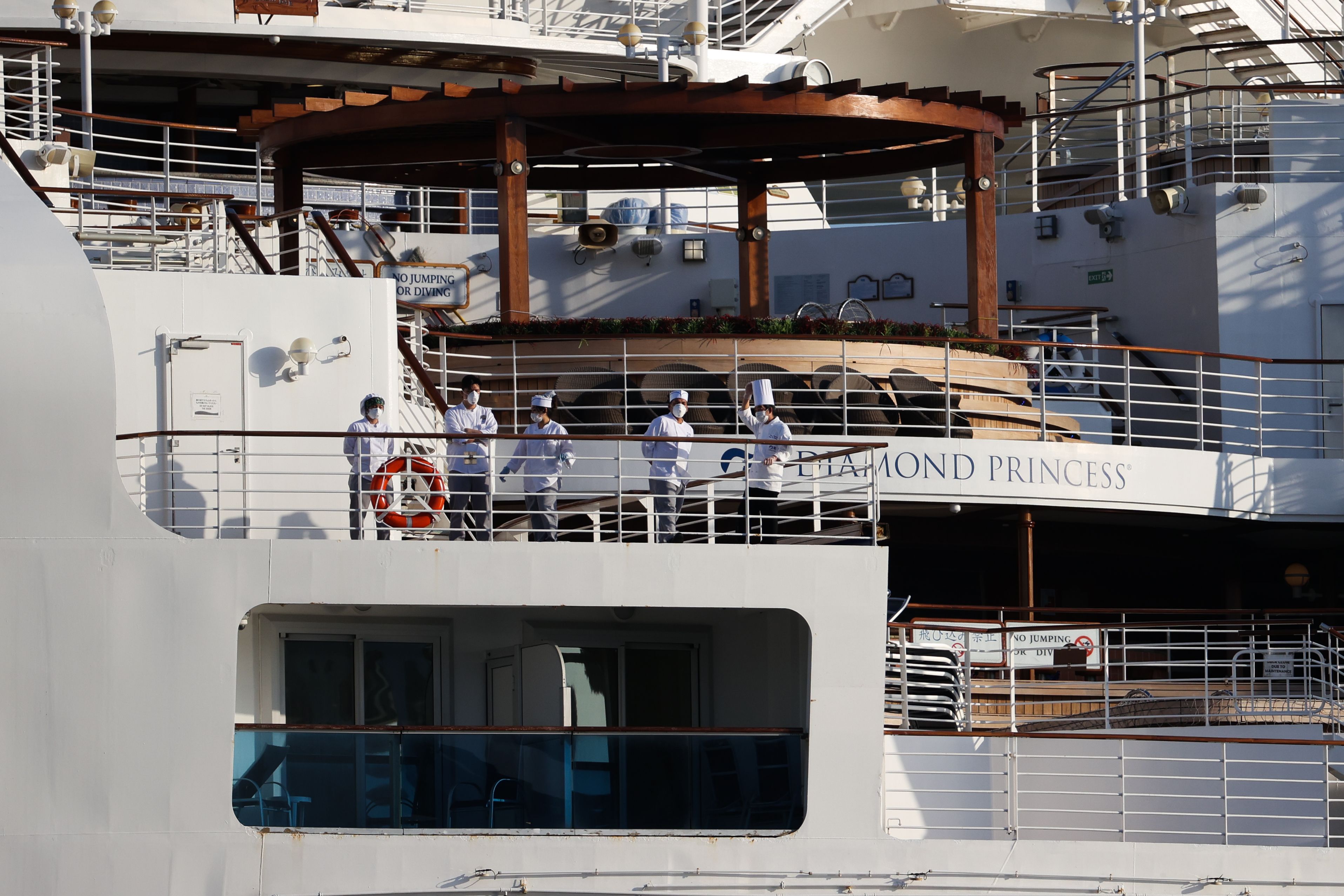 Passengers are seen on the quarantined Diamond Princess cruise ship at the Daikoku Pier on February 21, 2020 in Yokohama, Japan.