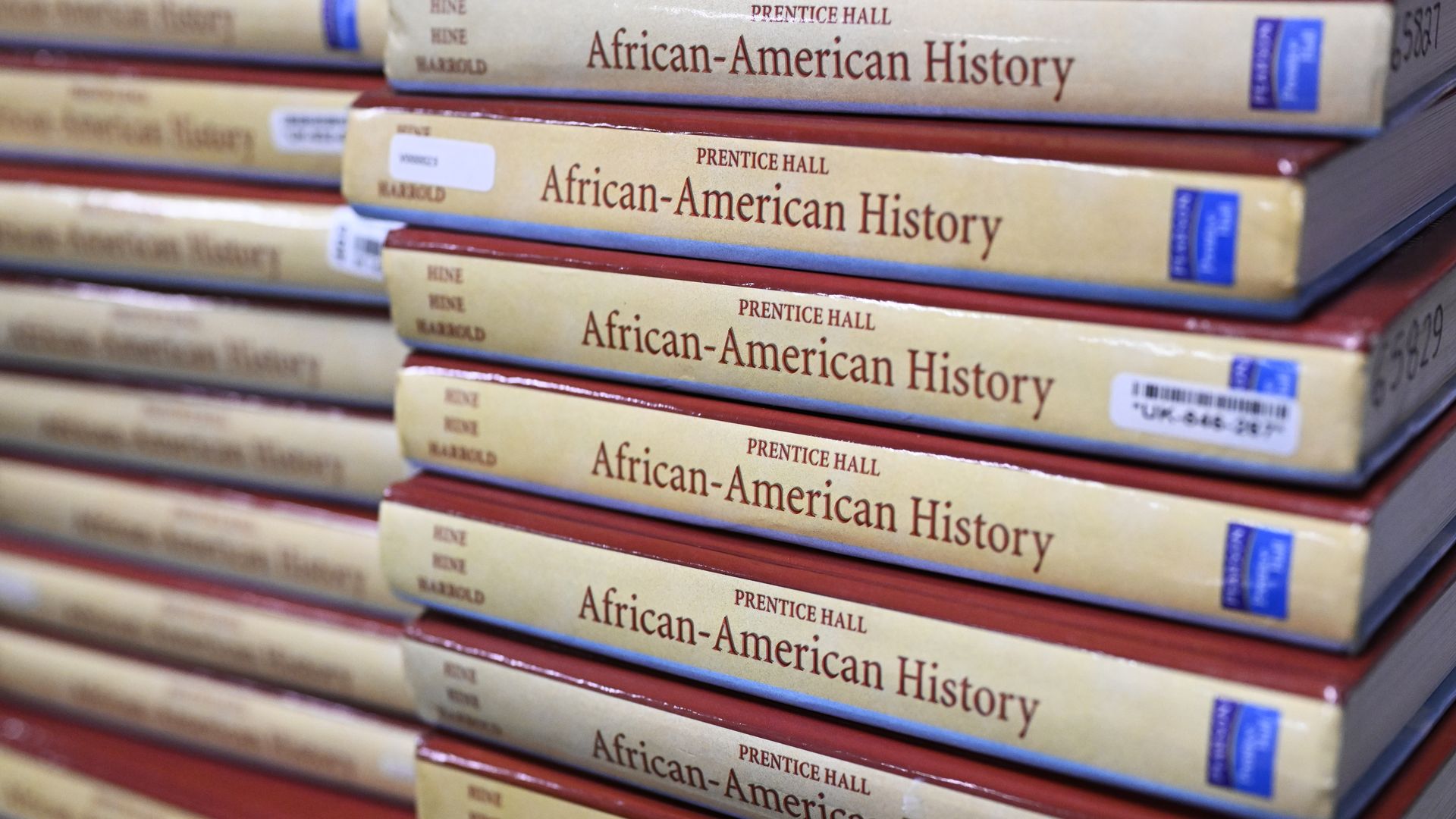 Books are piled up in the classroom for students takeing AP African-American Studies