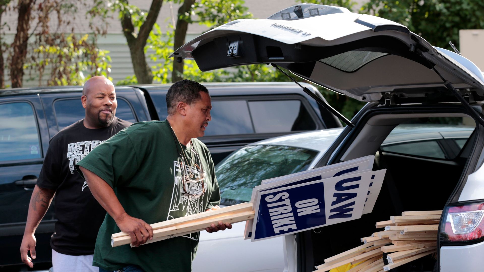 A General Motors Co. employee puts strike signs into his vehicle at the United Auto Workers (UAW) Local 163 which represents GMs Romulus Powertrain on September 15, 2019 in Westland, Michigan