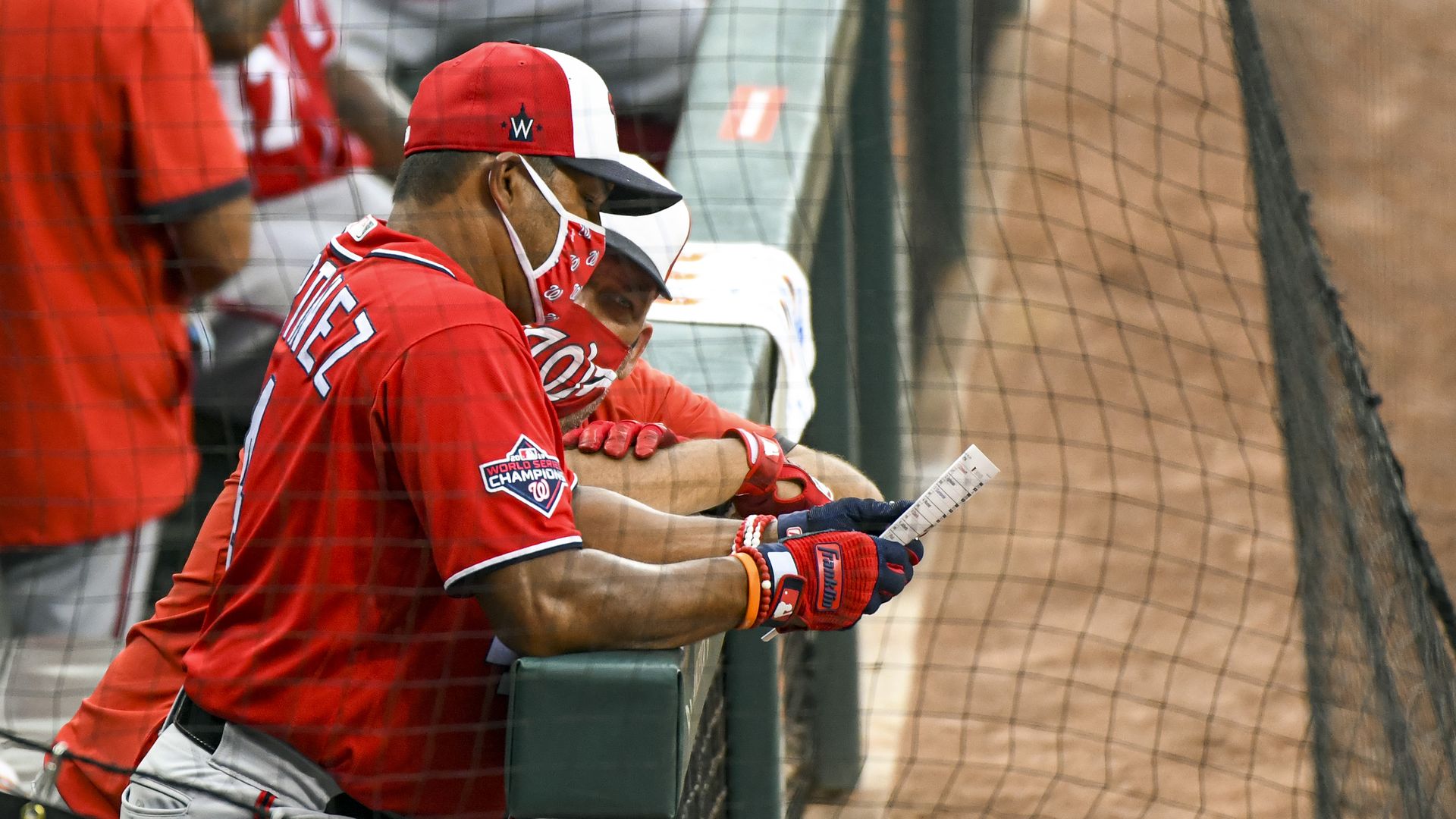 Washington Nationals manager David Martinez reviews his lineup during a spring training game against the Baltimore Orioles on Monday. Photo: Mark Goldman/Icon Sportswire via Getty Images