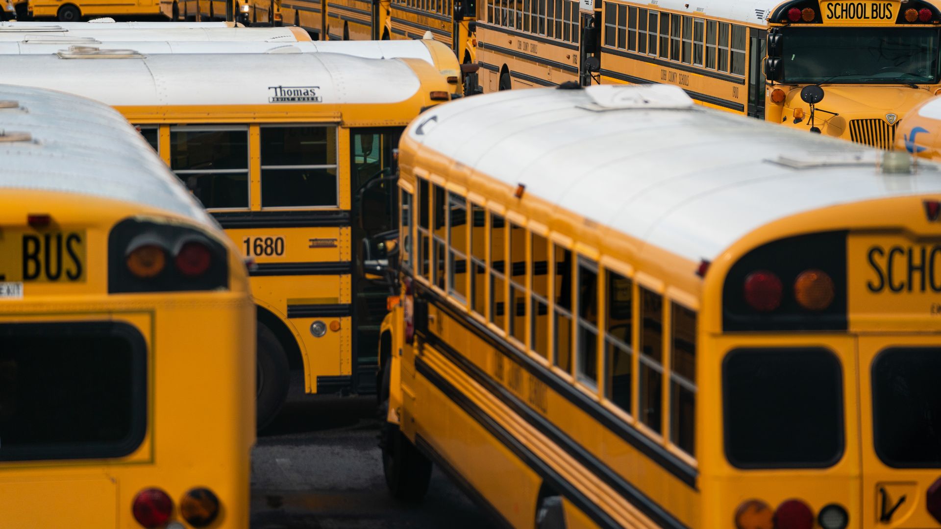 School buses sit parked at a lot in Marietta, Georgia, U.S., on Tuesday, March 24, 2020. 