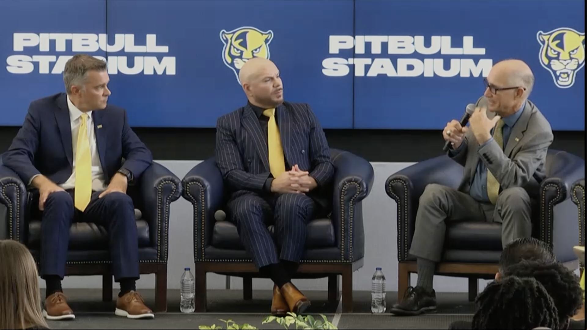 Pitbull (center) with FIU officials at a press conference announcing Pitbull Stadium