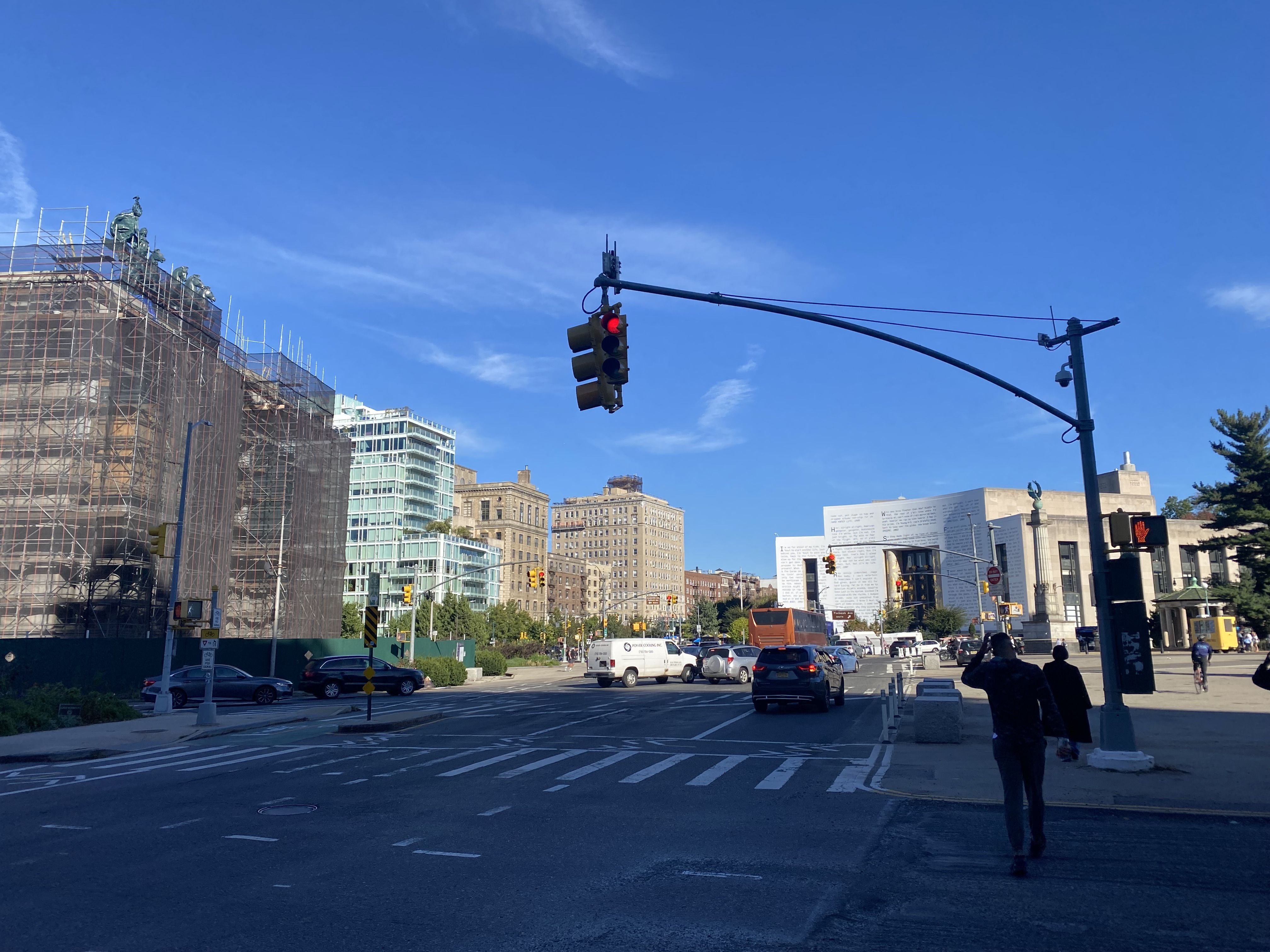 Photo of Grand Army Plaza, showing an intersection with the cured facade of the Brooklyn Public Library in the background