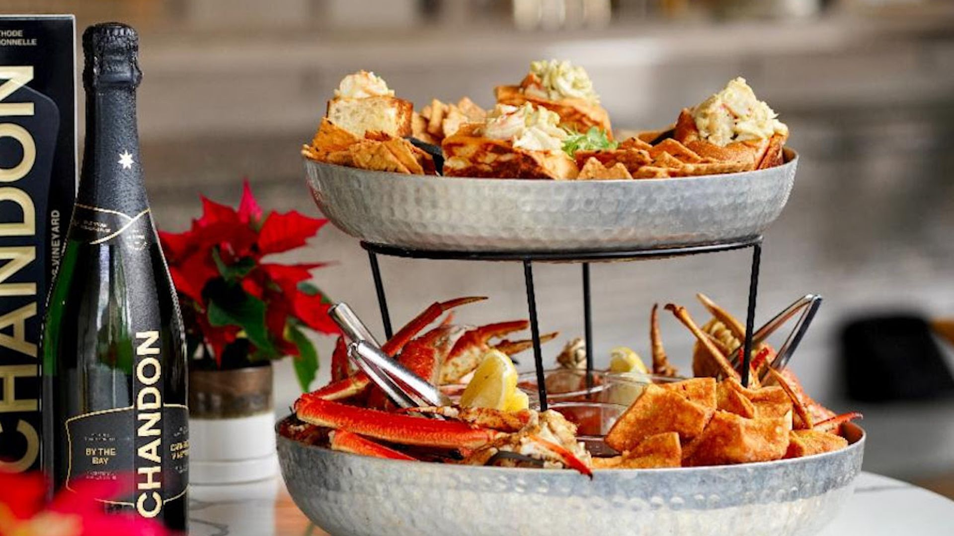 A Chandon bottle and crab seafood tower