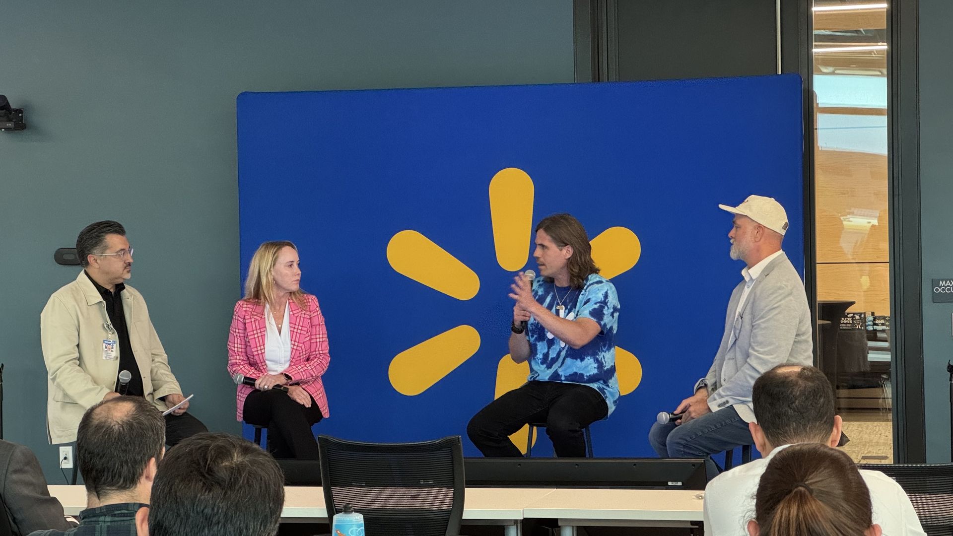 Mark Espinoza with Walmart corporate affairs, left, interviews Tricia Wallwork, CEO of  Milo's Tea; Sean Riley co-founder of DUDE Wipes and Mark Bray, owner of Airship Coffee. 