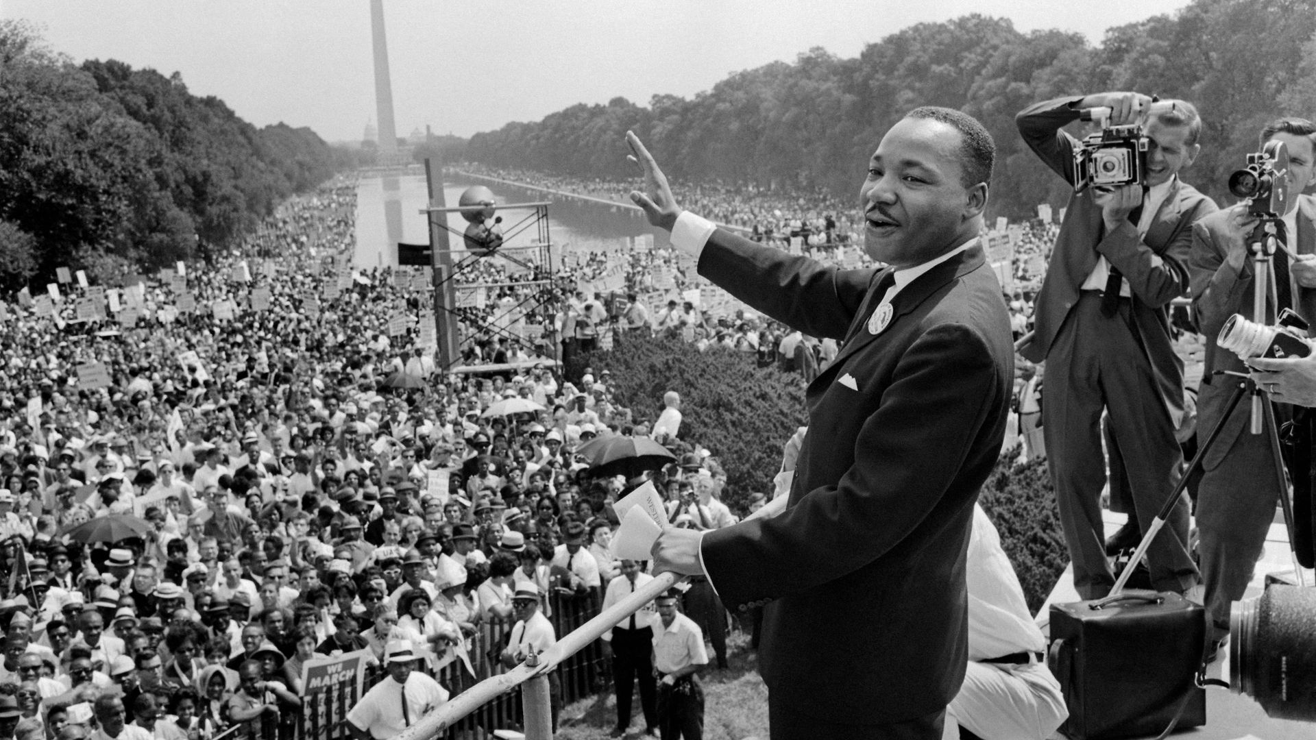 Martin Luther King waves to supporters at the March on Washington in 1963