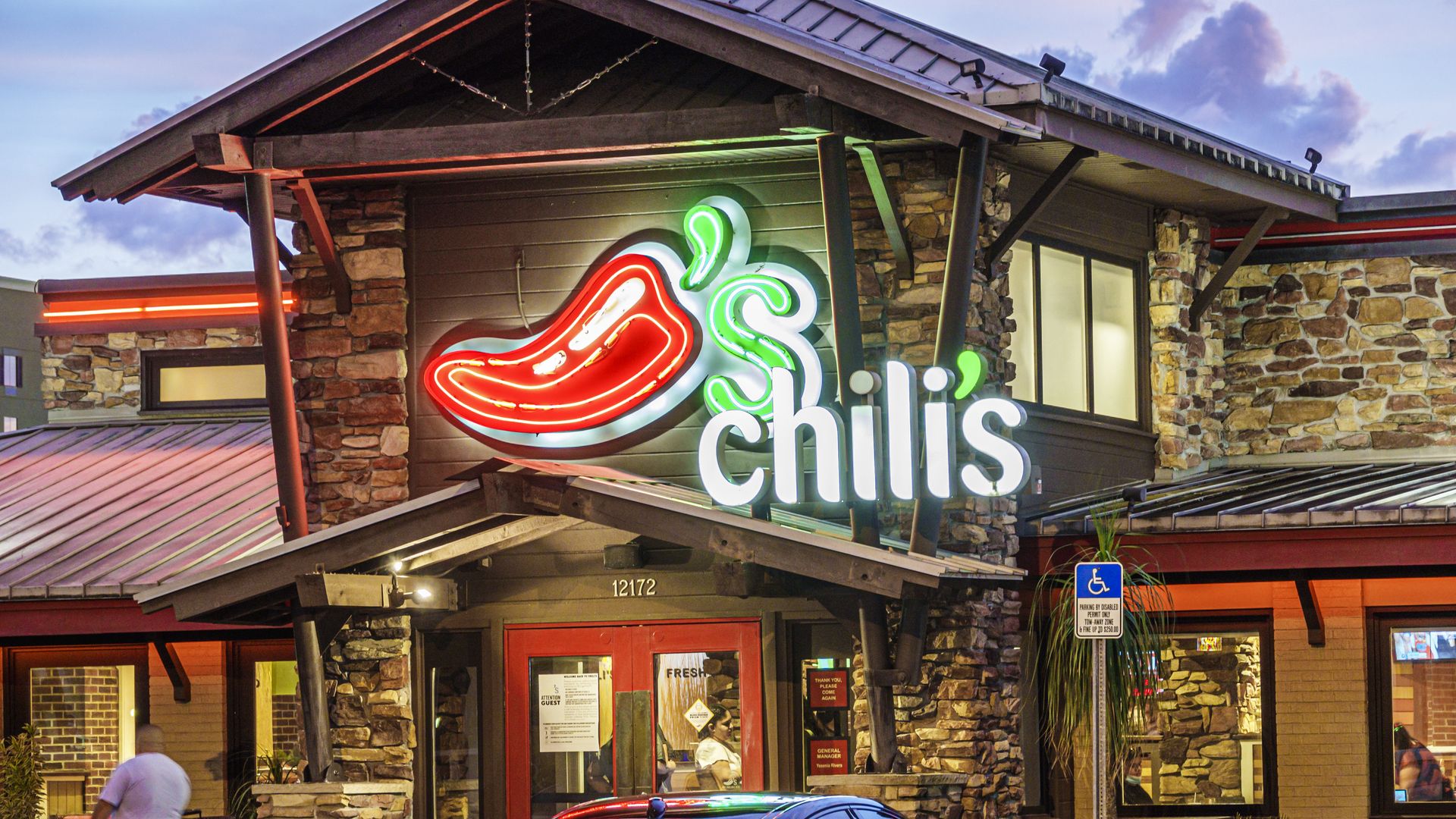 The exterior of a Chili's restaurant featuring its red pepper logo