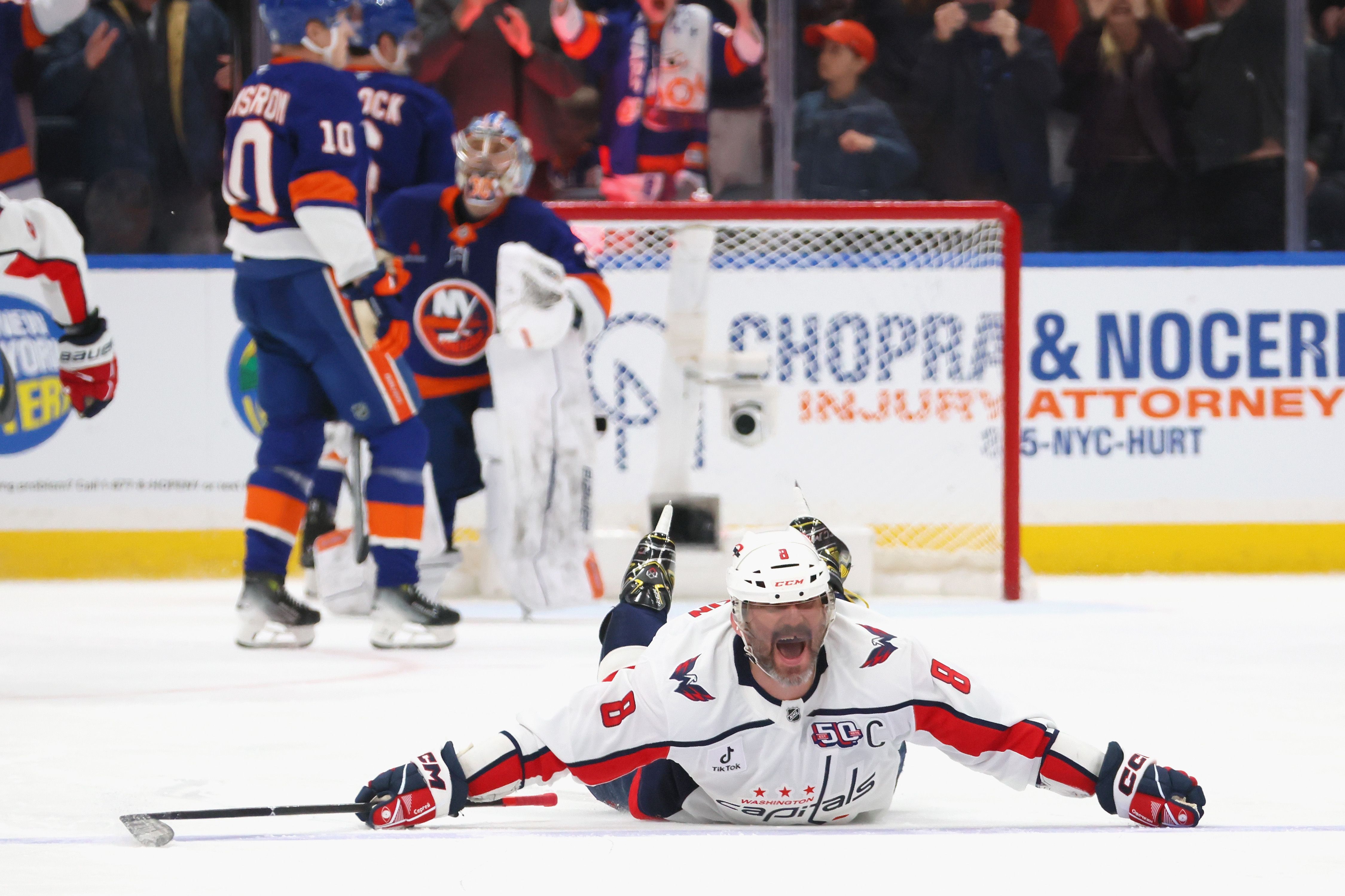 ELMONT, NEW YORK - APRIL 06: Alex Ovechkin #8 of the Washington Capitals celebrates after scoring his 895th career goal during the second period against the New York Islanders to become the NHL all-time goals leader at UBS Arena on April 06, 2025 in Elmont, New York. (Photo by Bruce Bennett/Getty Im