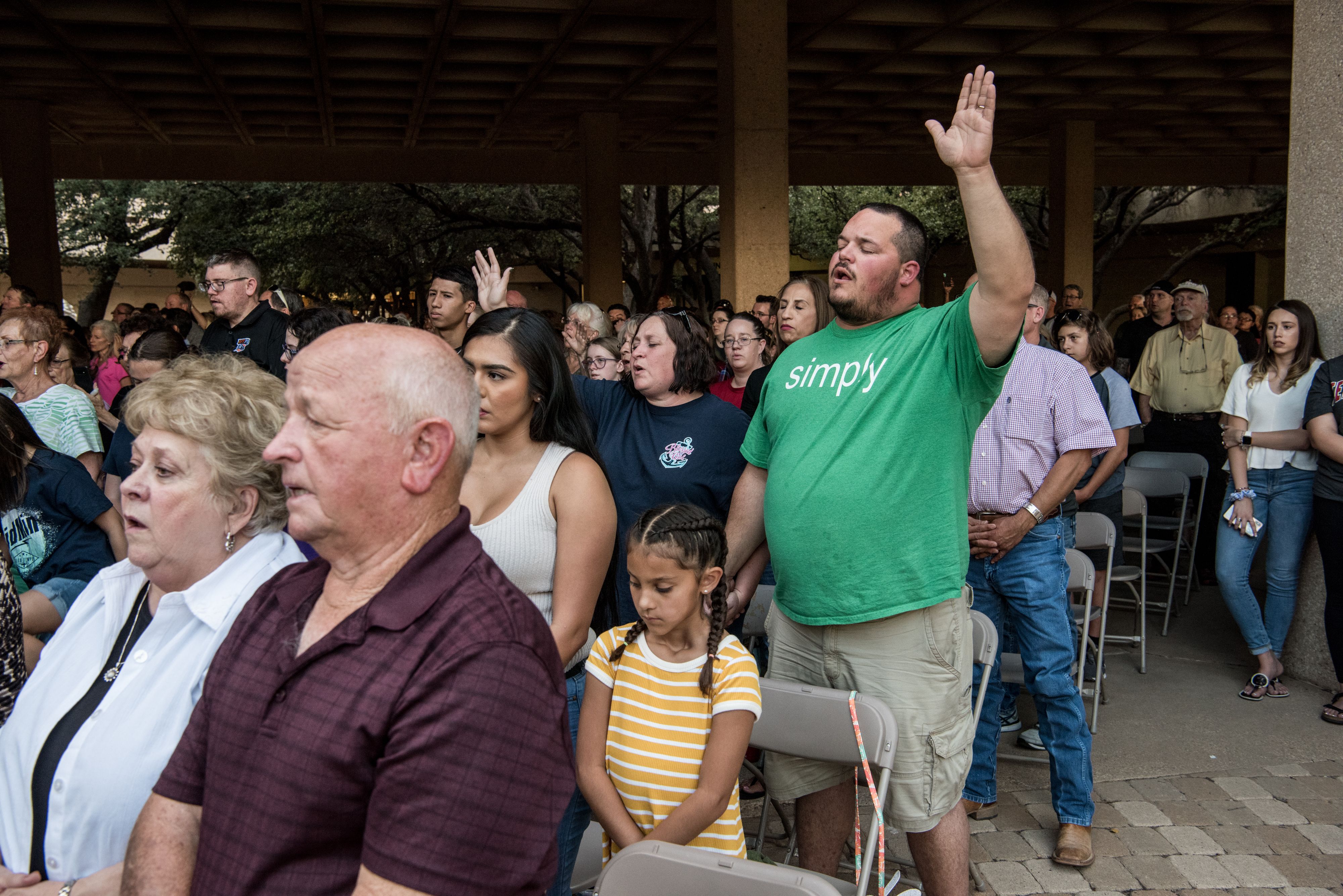 Charles Litchford prays during a vigil at the University of Texas of the Permian Basin (UTPB) for the victims of a mass shooting, September 1, 2019 in Odessa, Texas. 