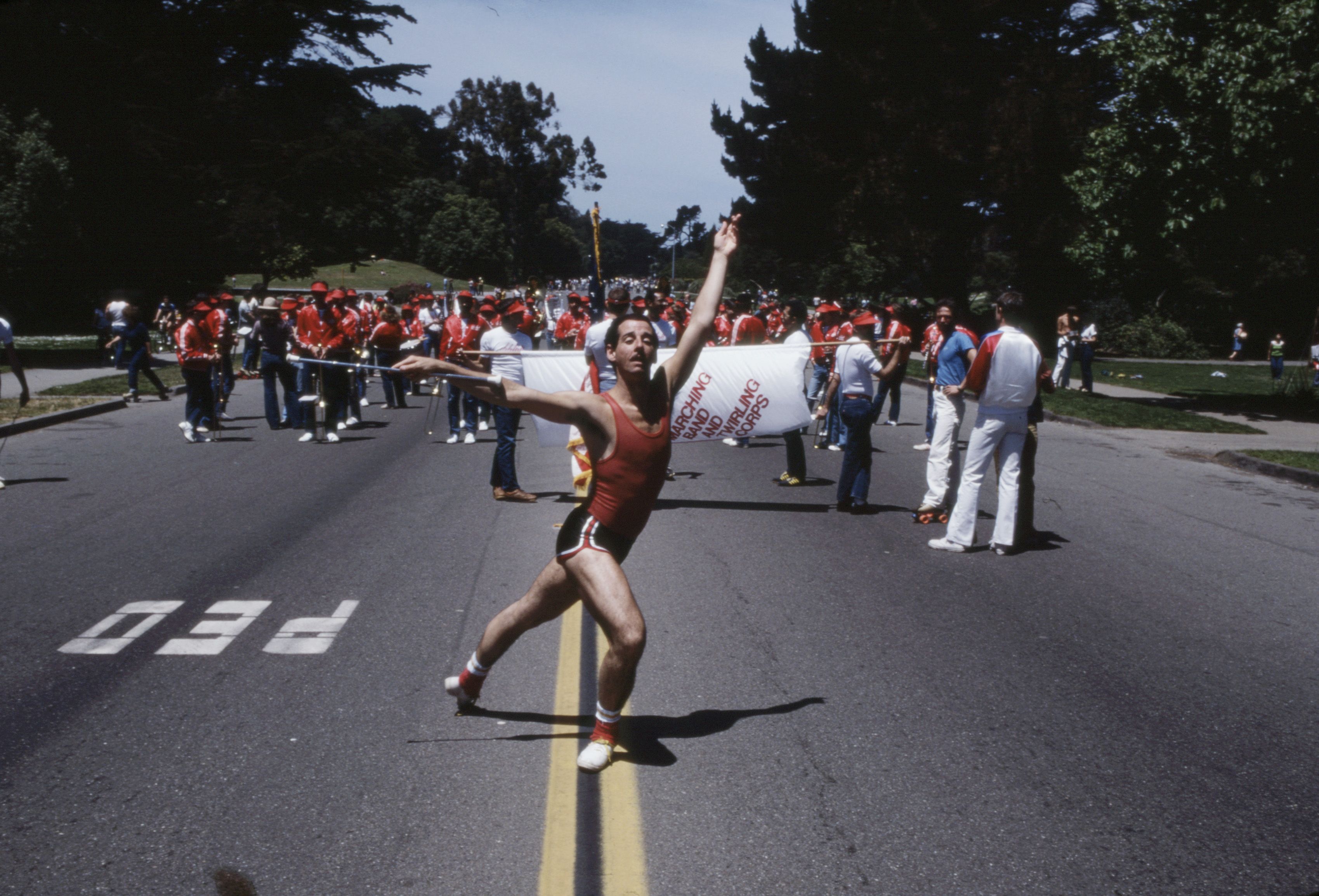 Photo of a twirling band performing on a street