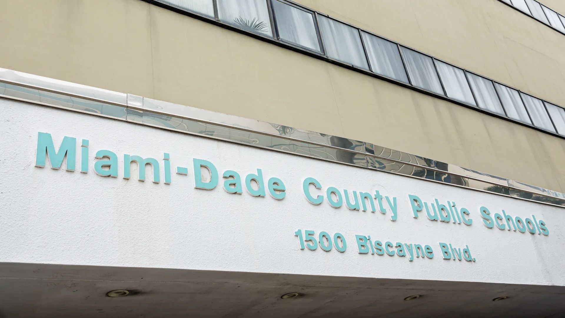 A sign reading "Miami-Dade County Public Schools."