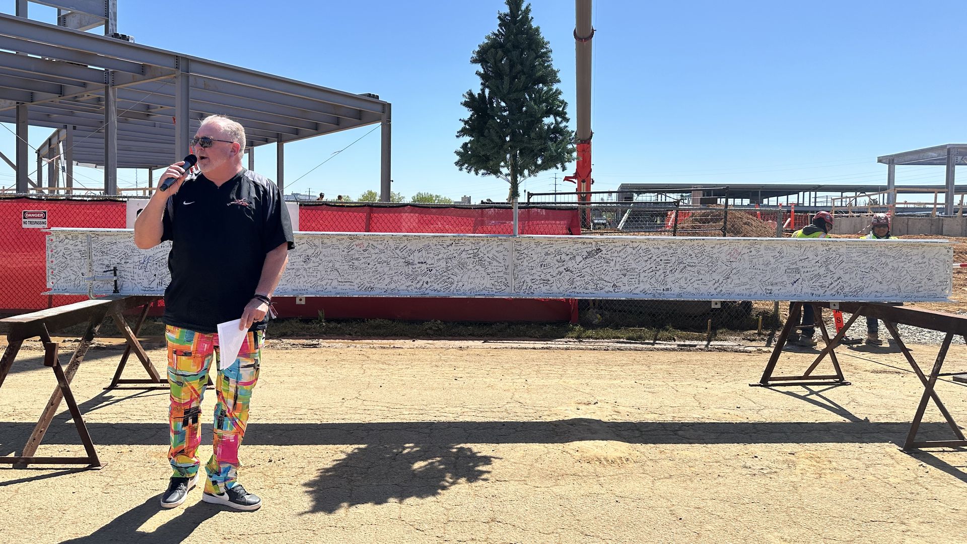a man in front of a beam 