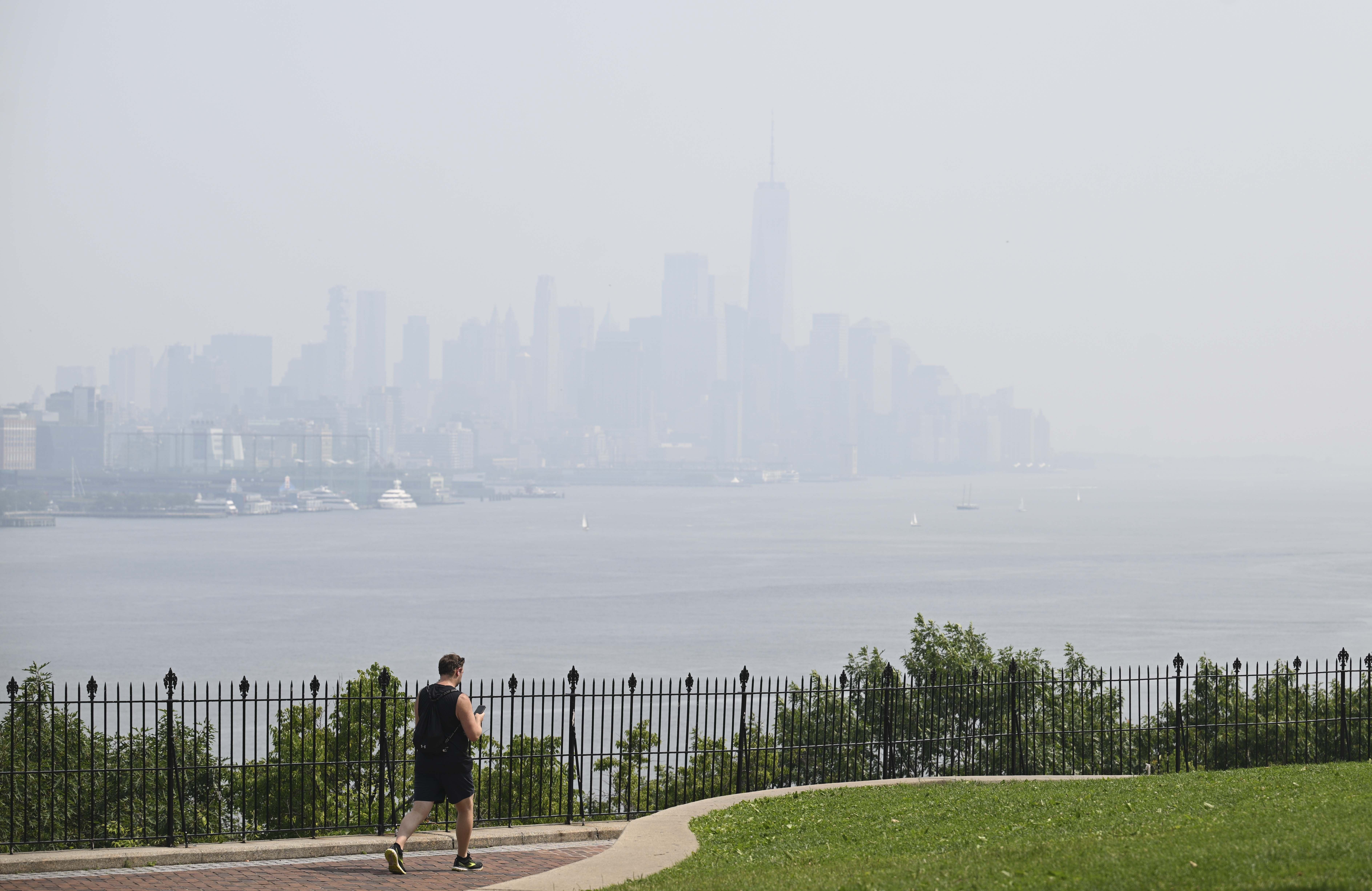 People carry on with their daily lives as the air quality is at unhealthy levels due to smoke from Canadian wildfires in New York, United States on June 29, 2023. Officials stated that the air quality may worsen in the upcoming days. 