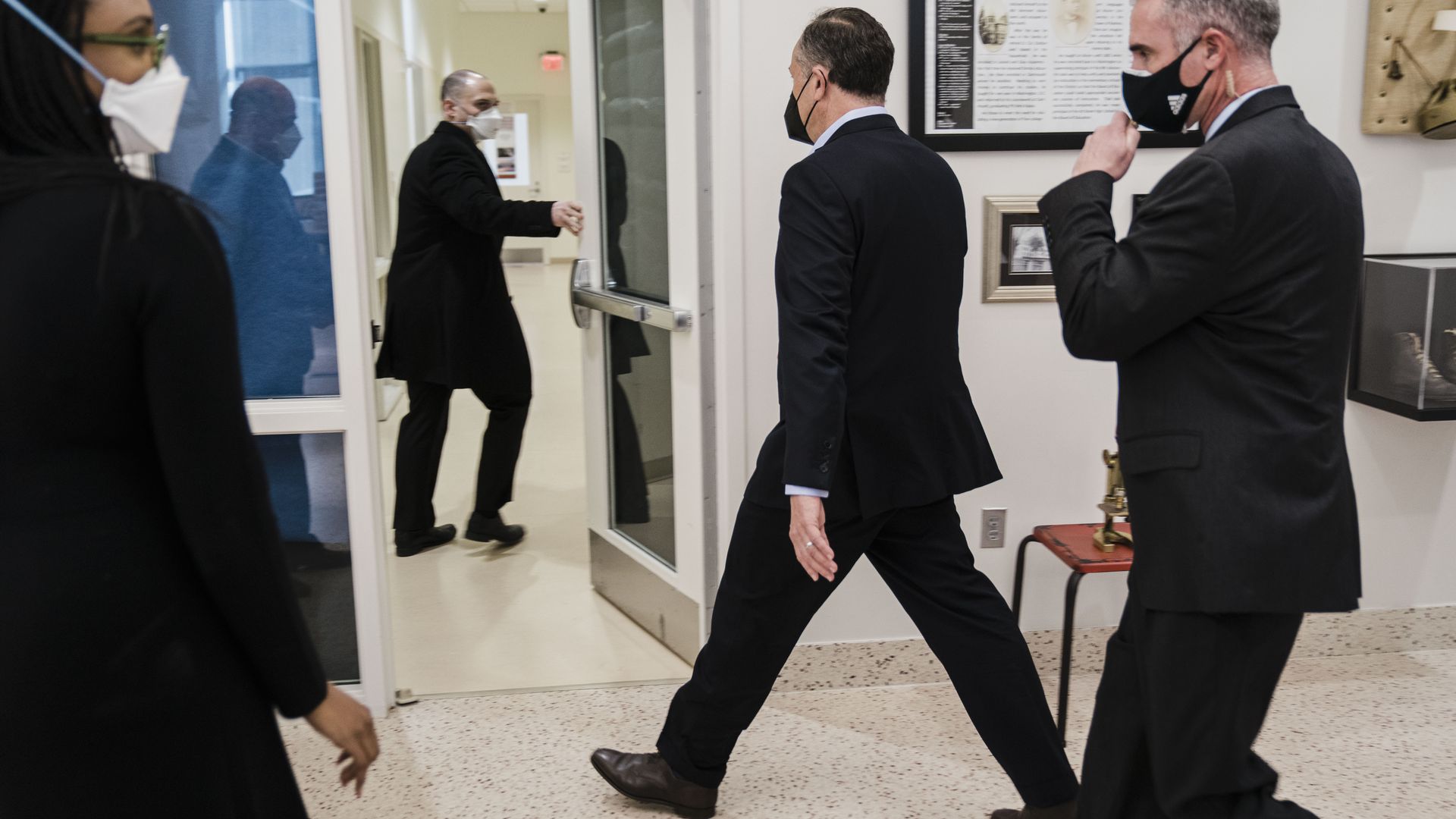 Secret Service agents are seen leading Second Gentleman Doug Emhoff out of a Washington school after a bomb threat.