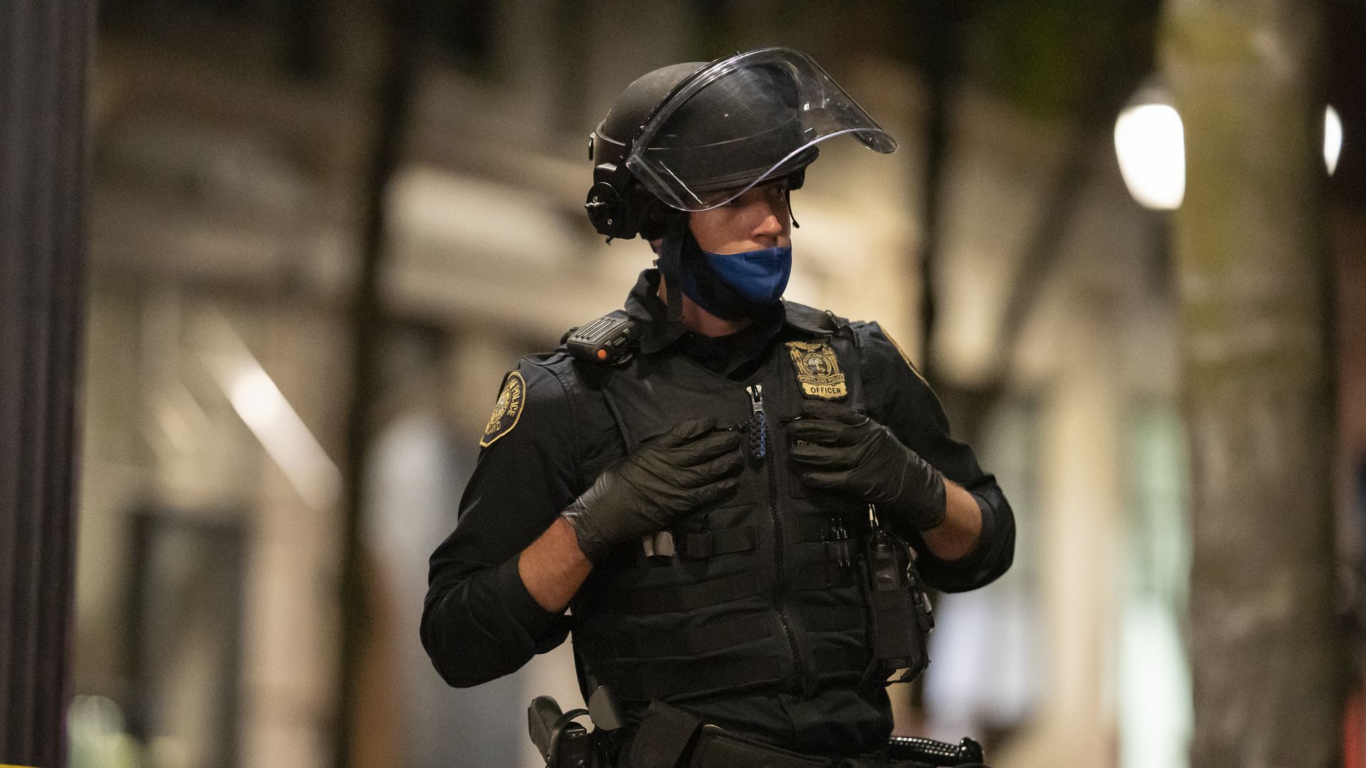 A Portland police officer guards the scene of a fatal shooting near a pro-Trump rally on August 29