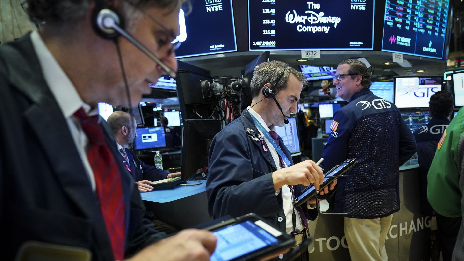 Traders on the stock exchange floor