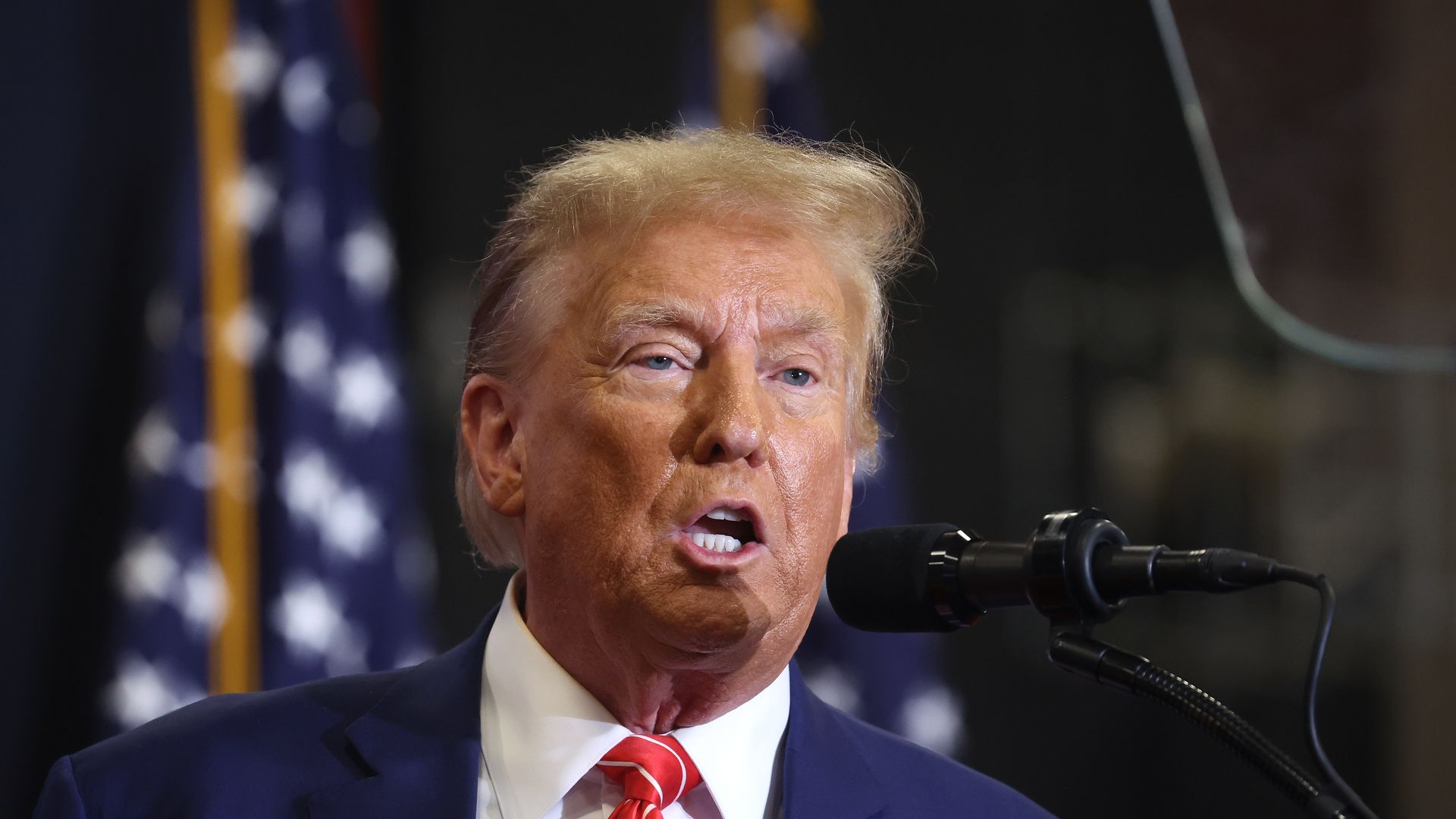 Republican presidential candidate former President Donald Trump speaks to guests during a rally at Clinton Middle School on January 06, 2024 in Clinton, Iowa.
