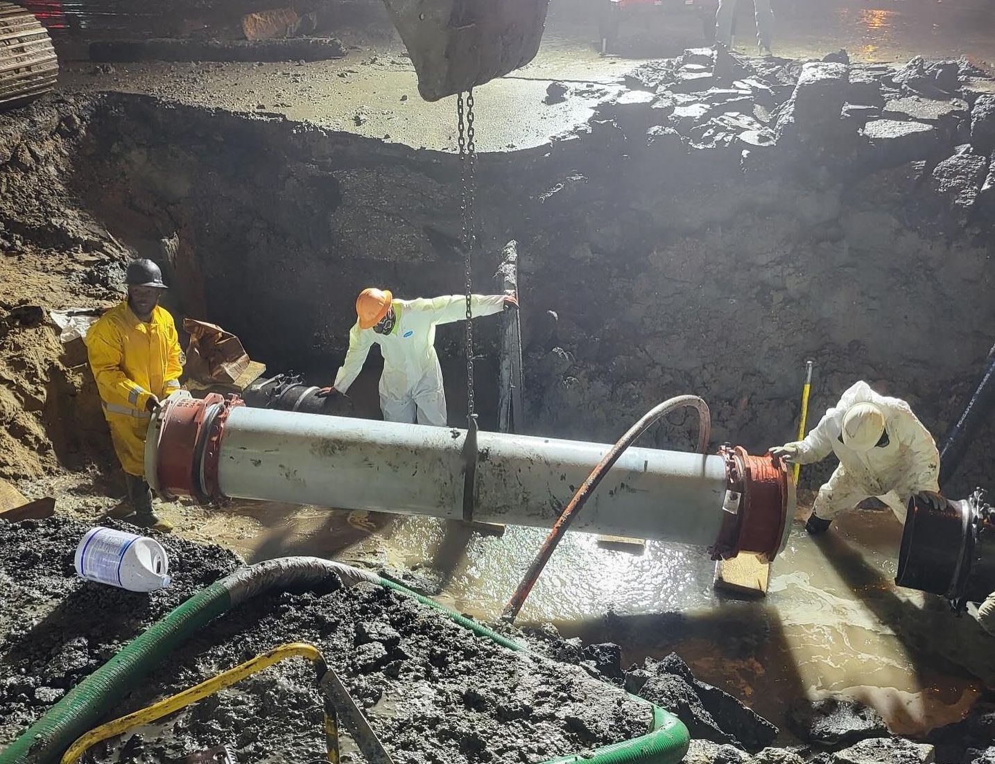 Photo shows workers replacing the broken pipe in Metairie