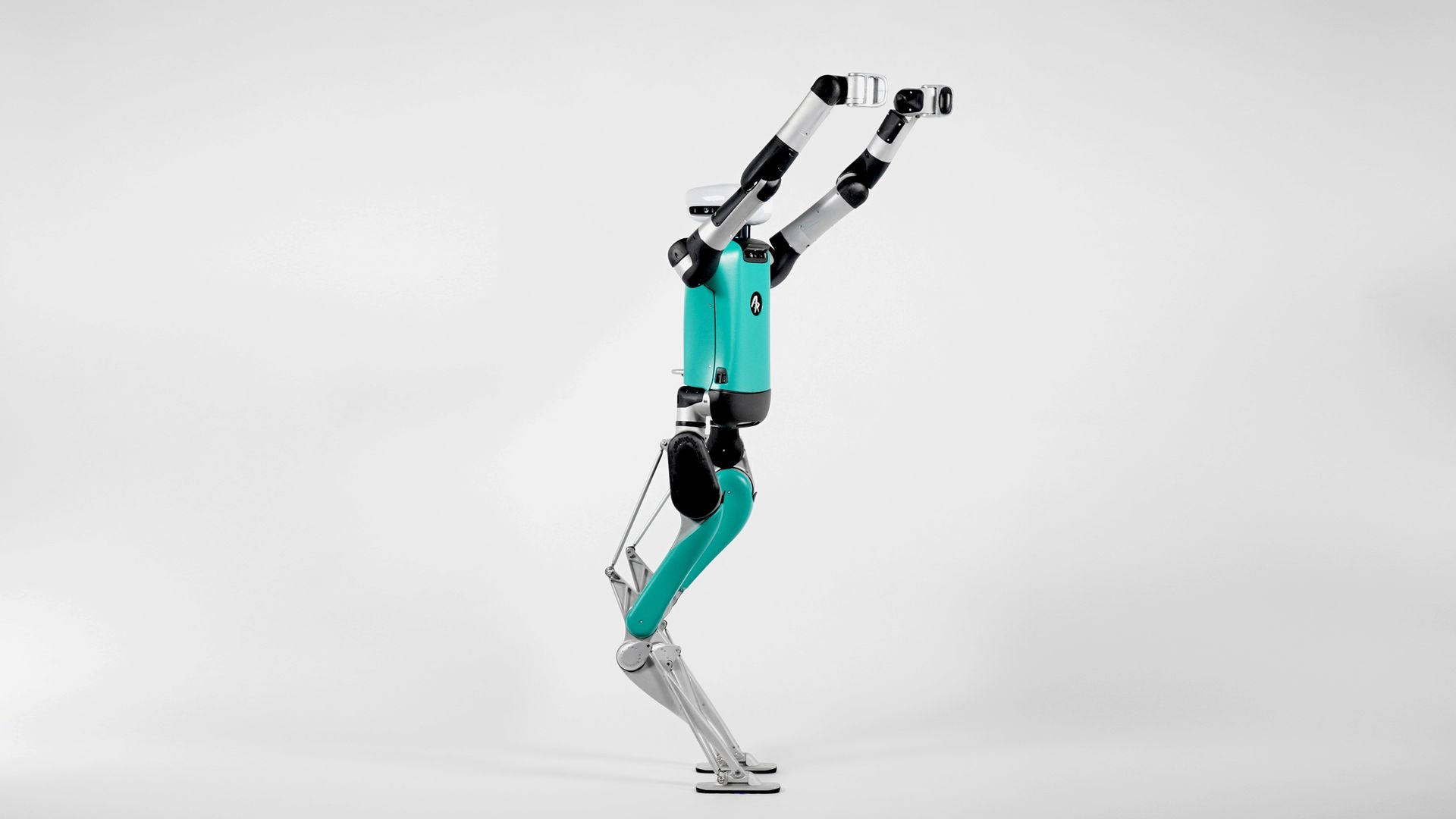 A humanoid robot perched on two legs and reaching upwards with its arms.