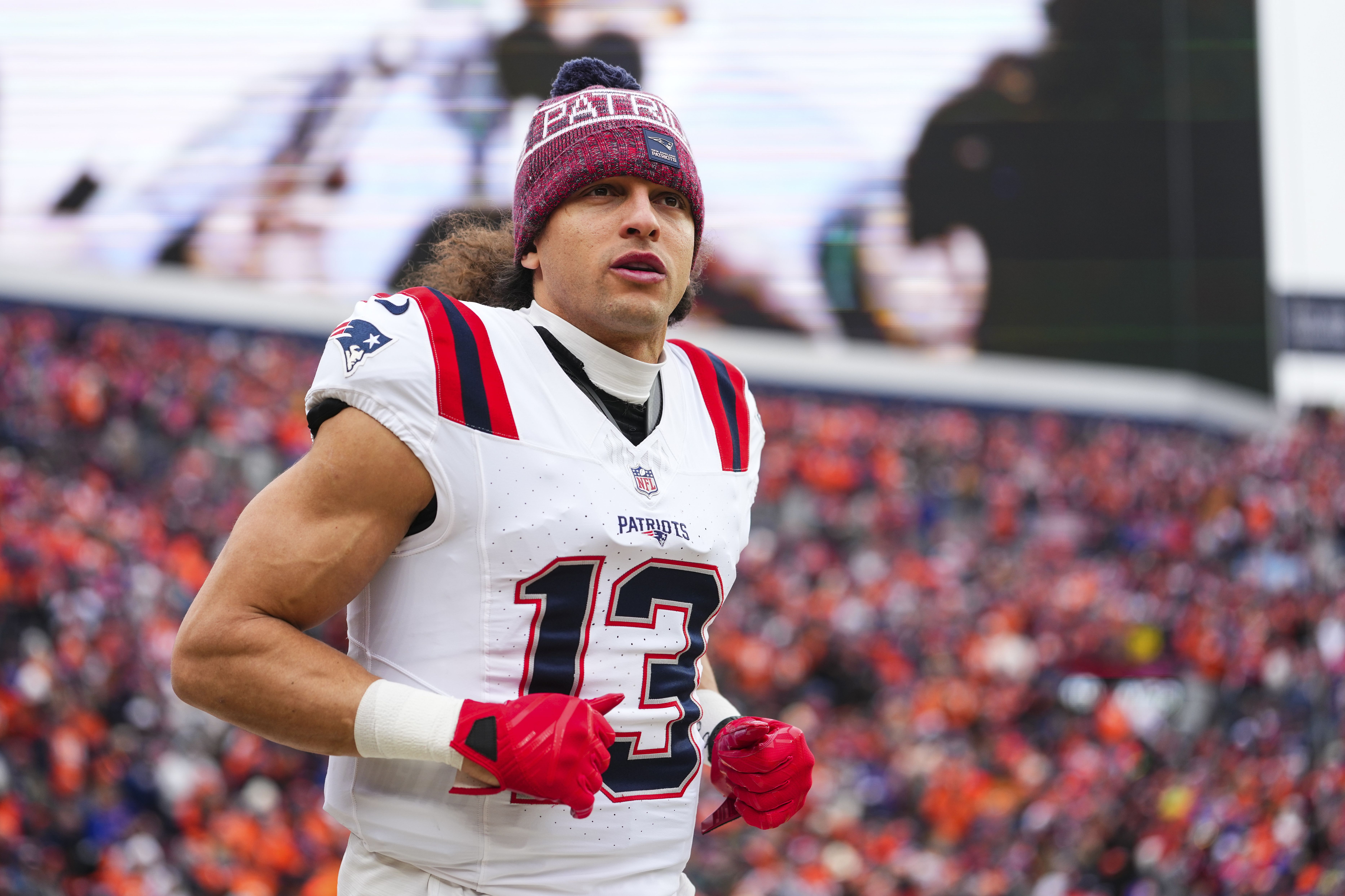  Mack Hollins #13 of the New England Patriots runs out of the tunnel prior to the AFC Championship NFL football game against the Denver Broncos at Empower Field At Mile High on January 25, 2026 in Denver, Colorado. (Photo by Cooper Neill/Getty Images)