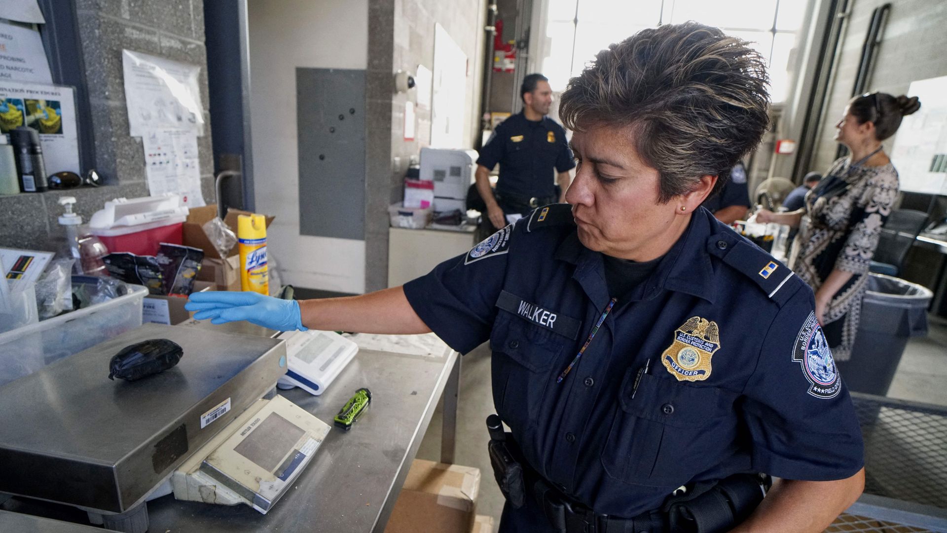 A US Customs and Border Protection agent weighs a package of Fentanyl at the San Ysidro Port of Entry on October 2, 2019 in San Ysidro, California. 