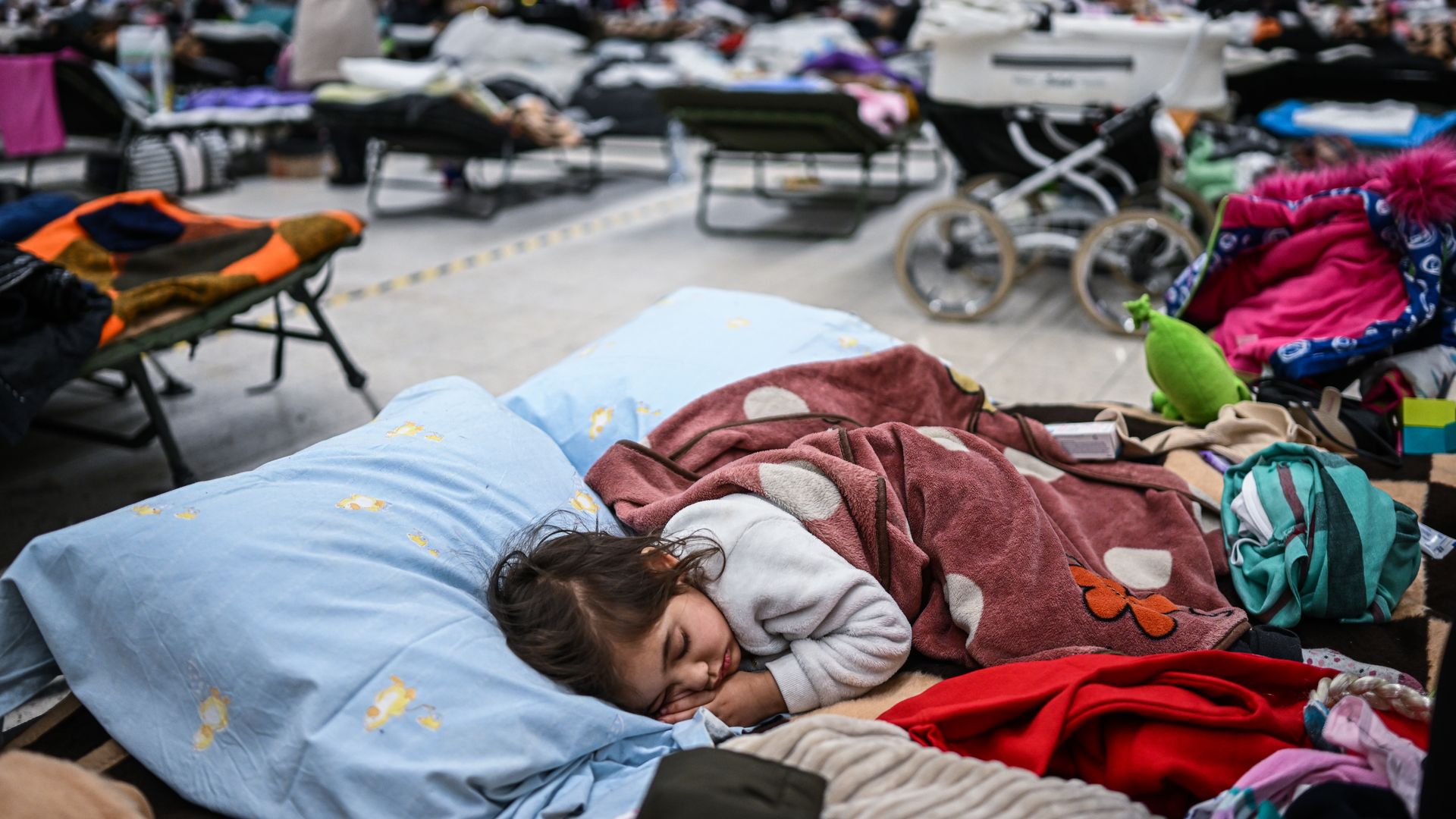 Children who fled the war in Ukraine rest inside a temporary refugee shelter on March 8 in Przemysl, Poland.