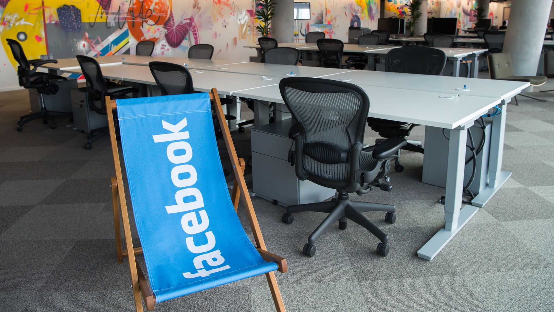 Deserted desks and a reclining chair featuring the logo of 'Facebook' stand in the new office of 'Facebook Deutschland' at the Potsdamer Platz in Berlin, Germany, 