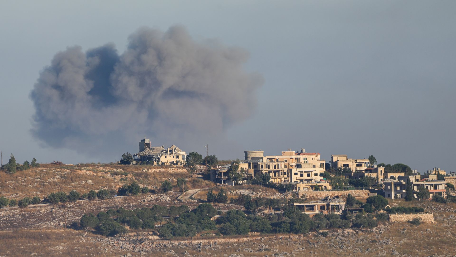Smoke rises from the town of Shweikin and the Ali al-Tahir hill area in southern Lebanon following Israeli airstrikes on June 20.