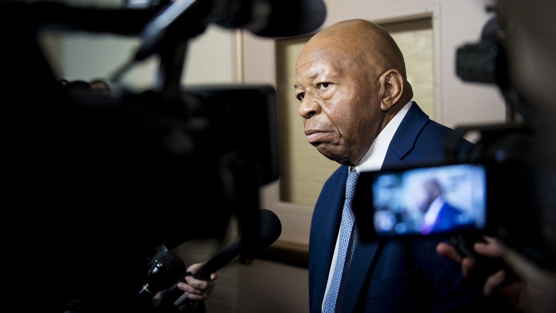 Rep. Elijah Cummings, D-Md., leaves the House Democrats' caucus meeting in the Capitol 