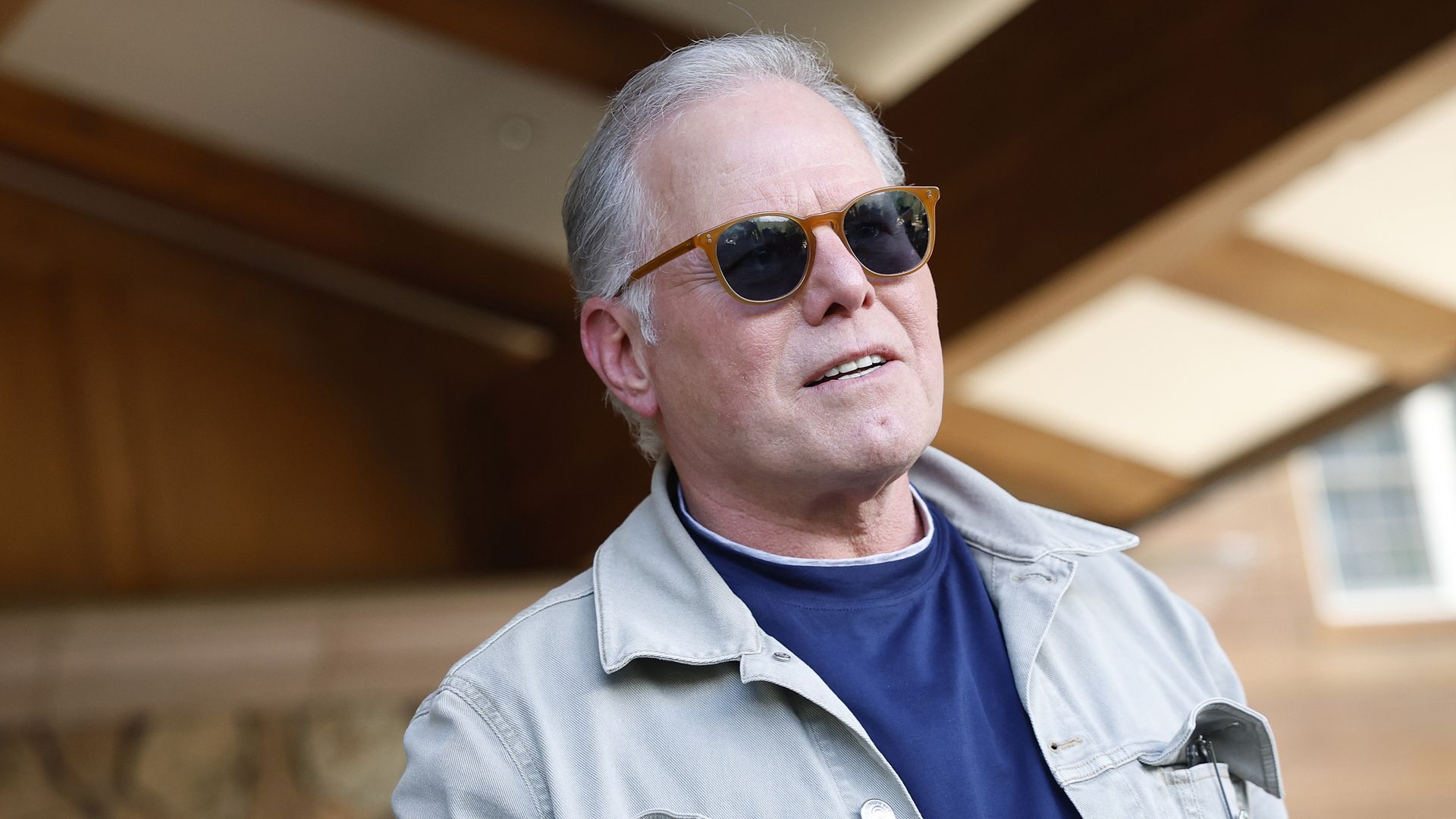 CEO of Warner Bros. Discovery David Zaslav speaks to members of the media as he arrives at the Sun Valley lodge.