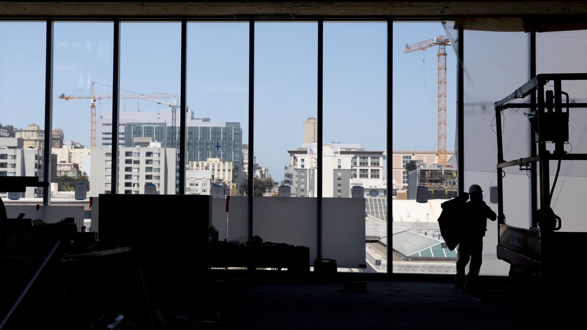 Photo of people working on a construction site in an apartment building