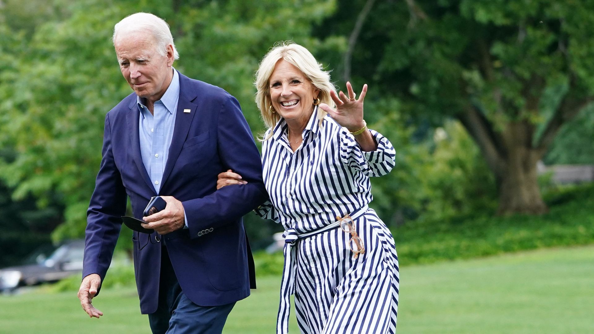 Joe Biden and US First Lady Jill Biden walk on the South Lawn