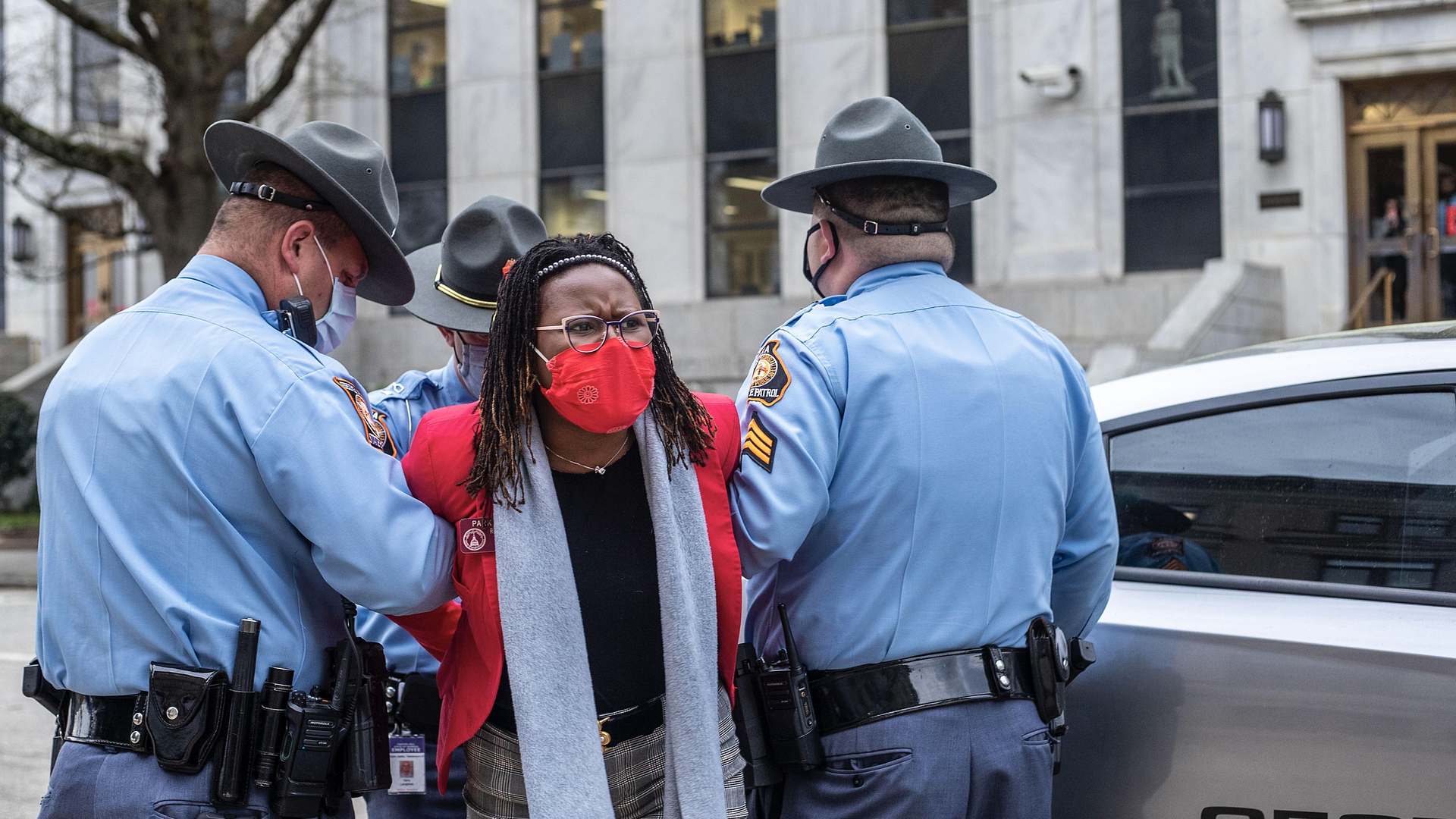 A photo of Georgia State Rep. Park Cannon being taken into custody.