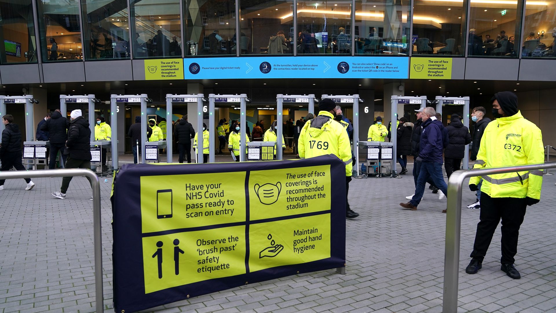 Coronavirus signage outside the ground ahead of the Premier League match at the Tottenham Hotspur Stadium, London. Picture date: Sunday December 19, 2021