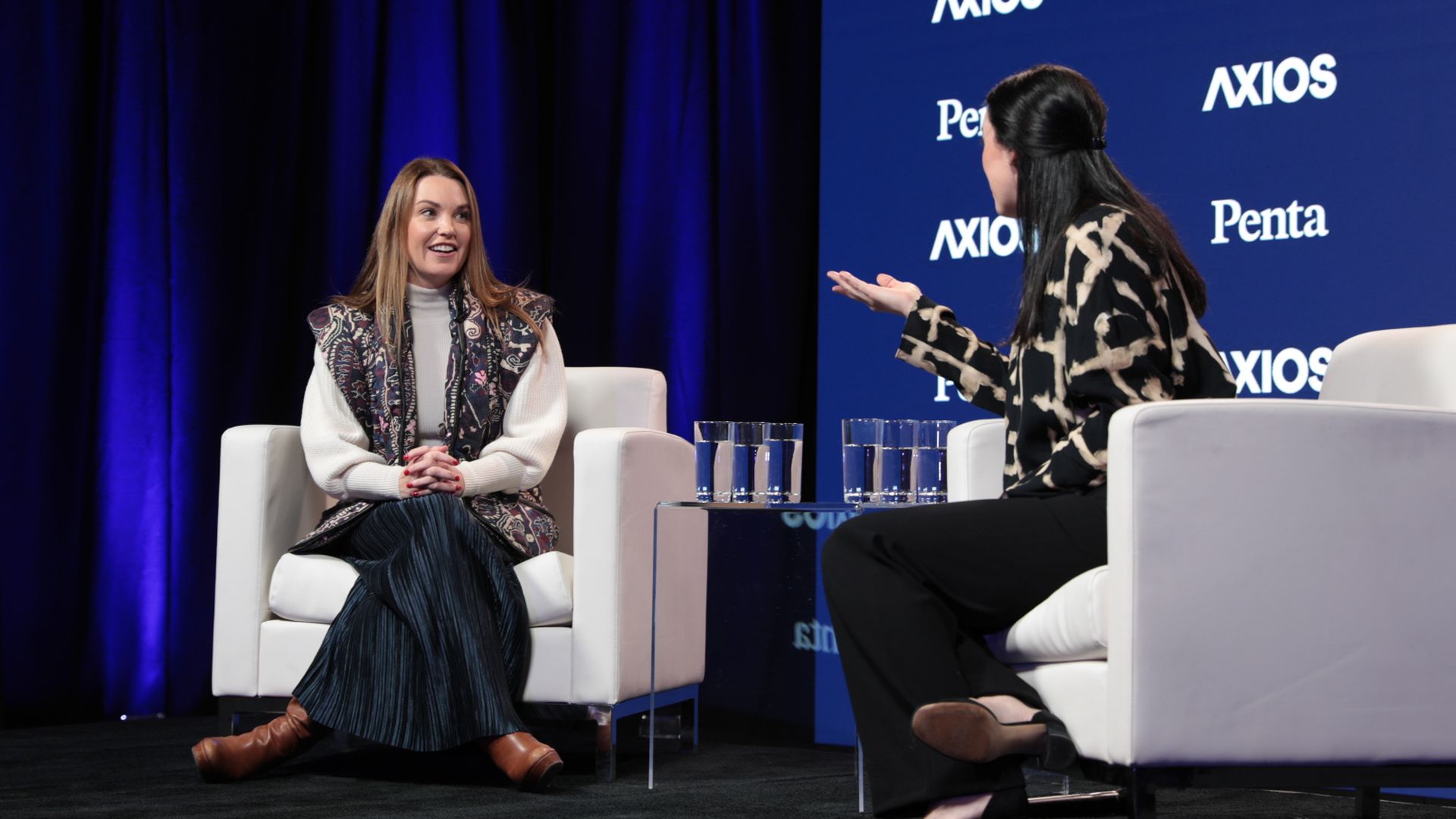 Dustee Jenkins on stage at an Axios event