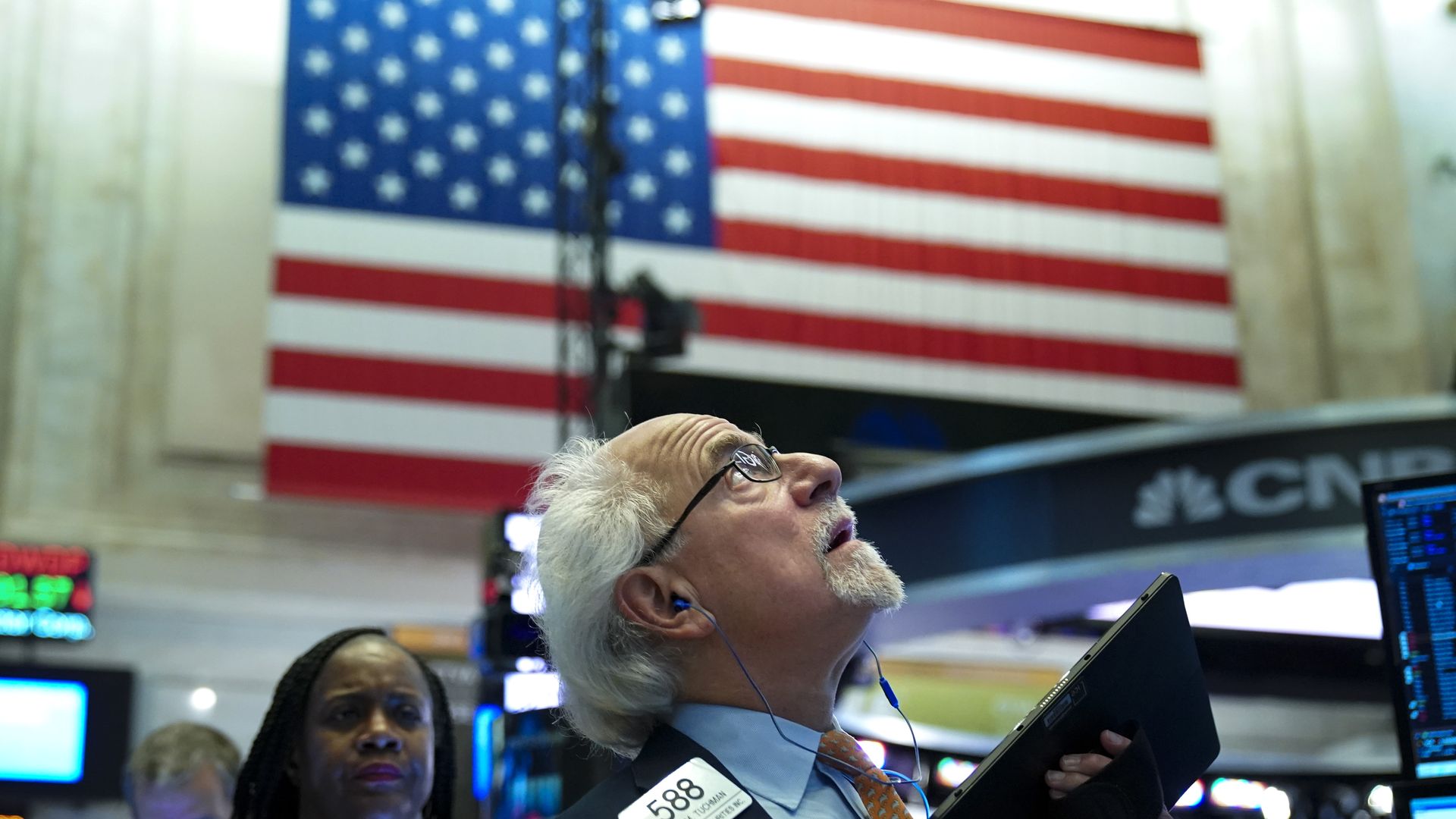 Traders and financial professionals work at the opening bell on the floor of the New York Stock Exchange (NYSE), June 3, 2019 in New York City.