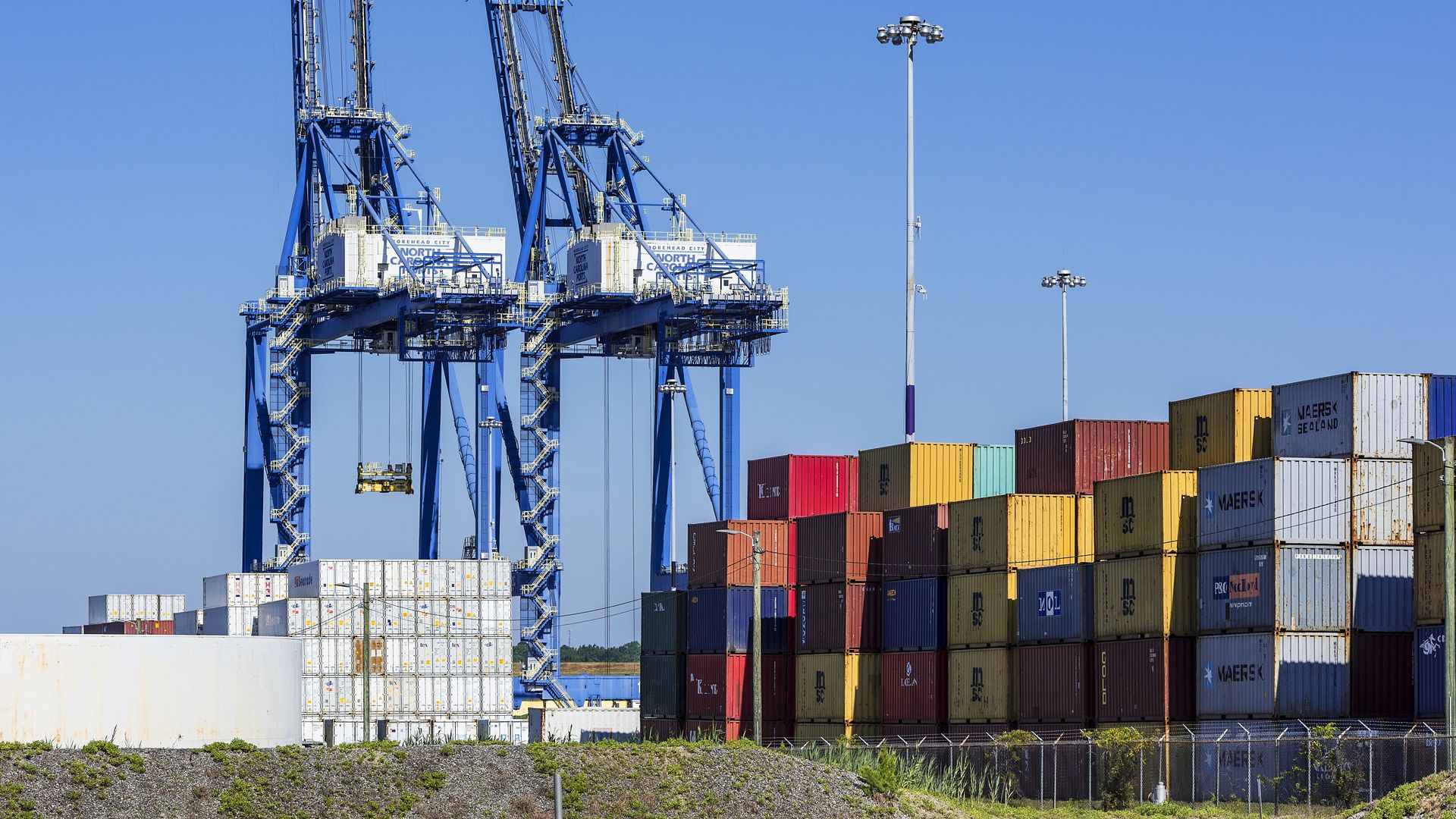 Cargo cranes and shipping containers at Wilmington in North Carolina. (Photo by: John Greim/Loop Images/Universal Images Group via Getty Images)