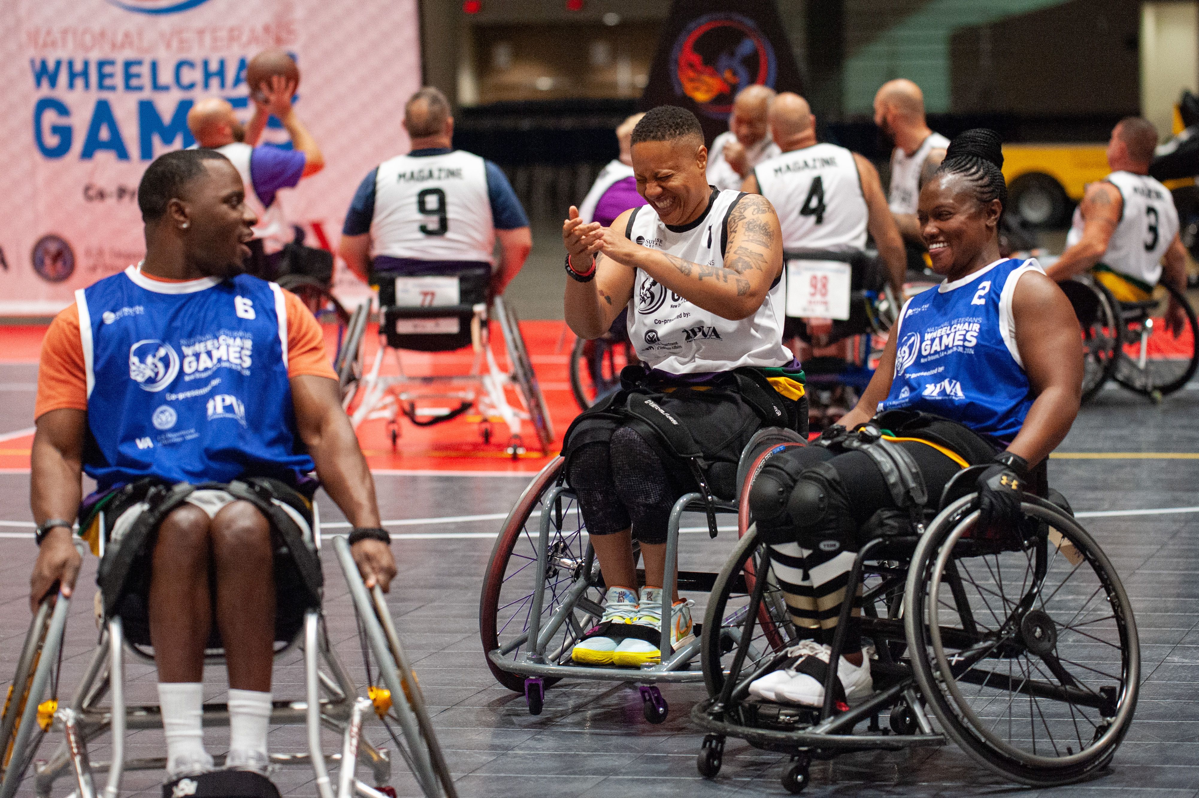 A trio of athletes share a laugh.