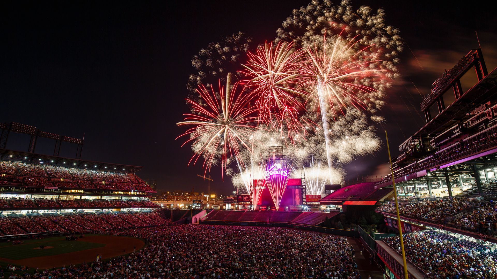 A fireworks display going off at Coors Field