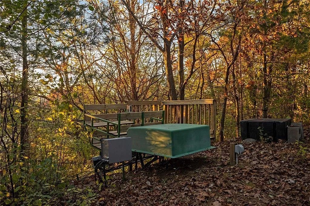 A wooden platform with a wood rail car. 