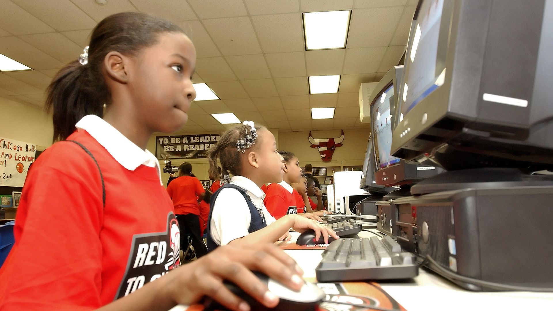 A photo of a student looking at a computer.