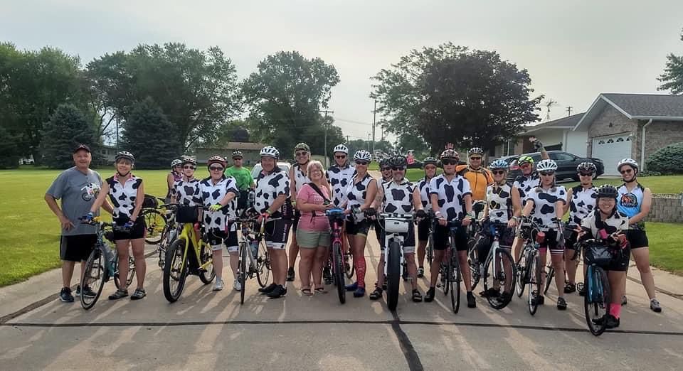 RAGBRAI's Team Cow wears matching cow print outfits on the Iowa bike ride.