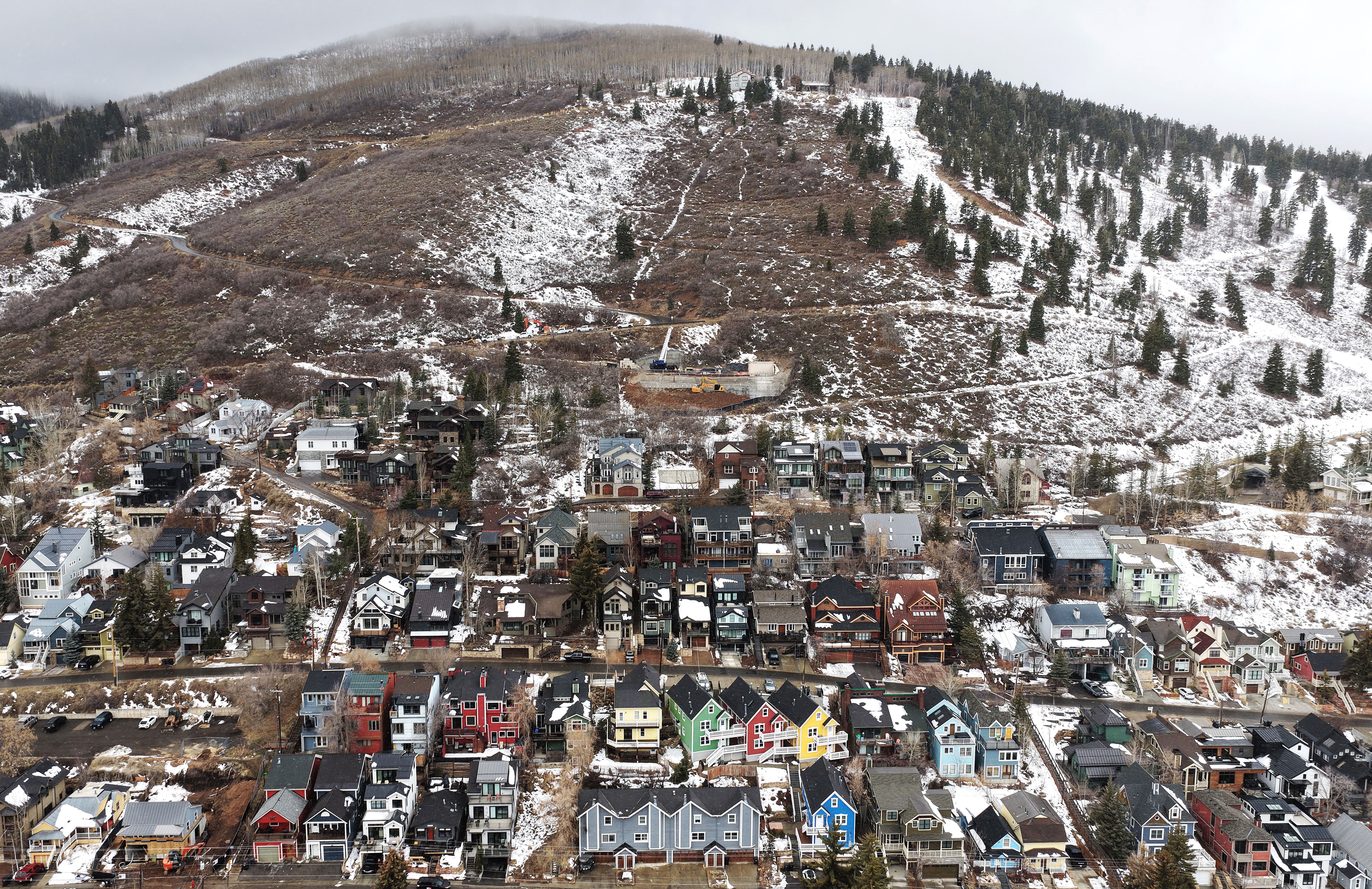 Light snow falls over an unusually barren Park City, Utah, on Monday. 
