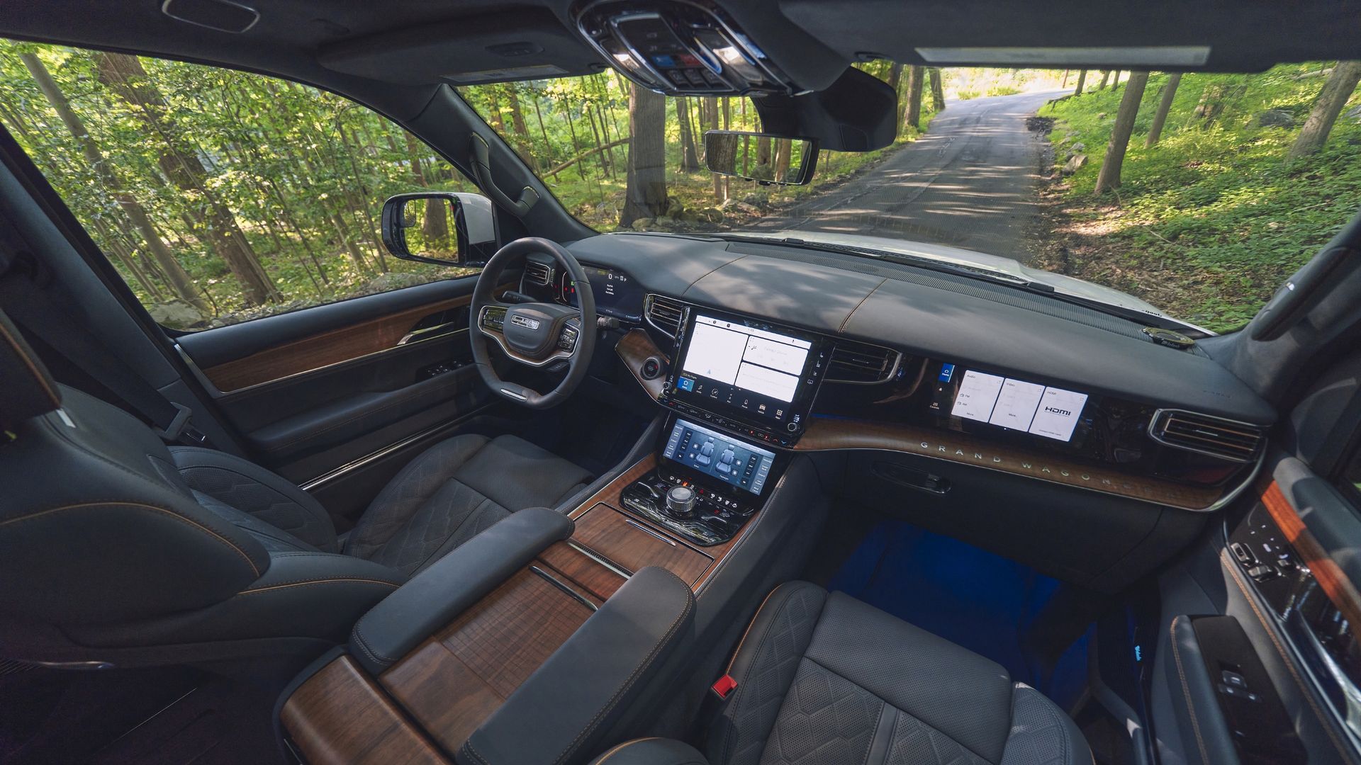 The luxurious interior of a 2022 Jeep Grand Wagoneer, as seen from above. 