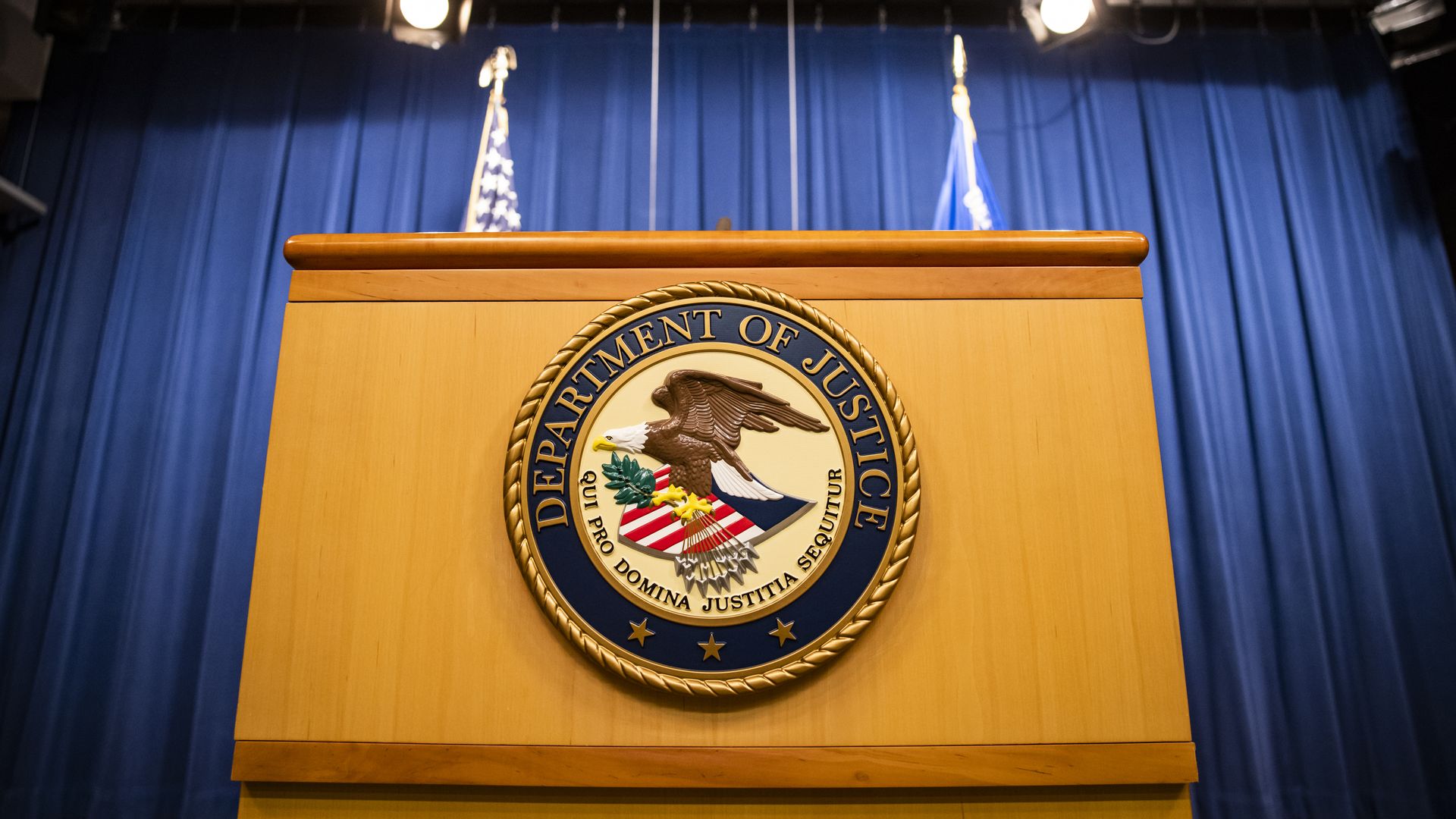 U.S. Department of Justice seal on a podium in Washington D.C. 