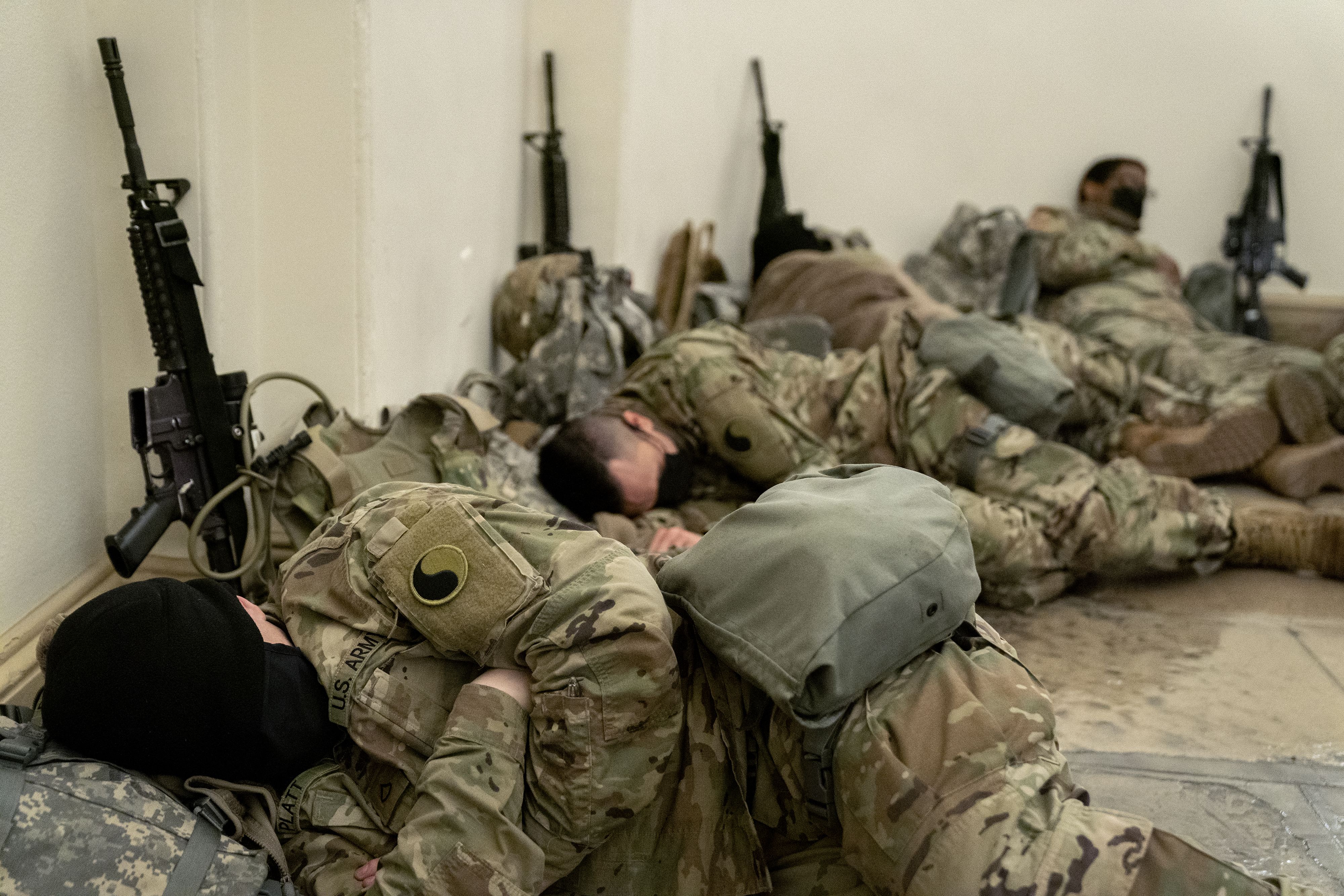 guardsmen sleeping on the ground 