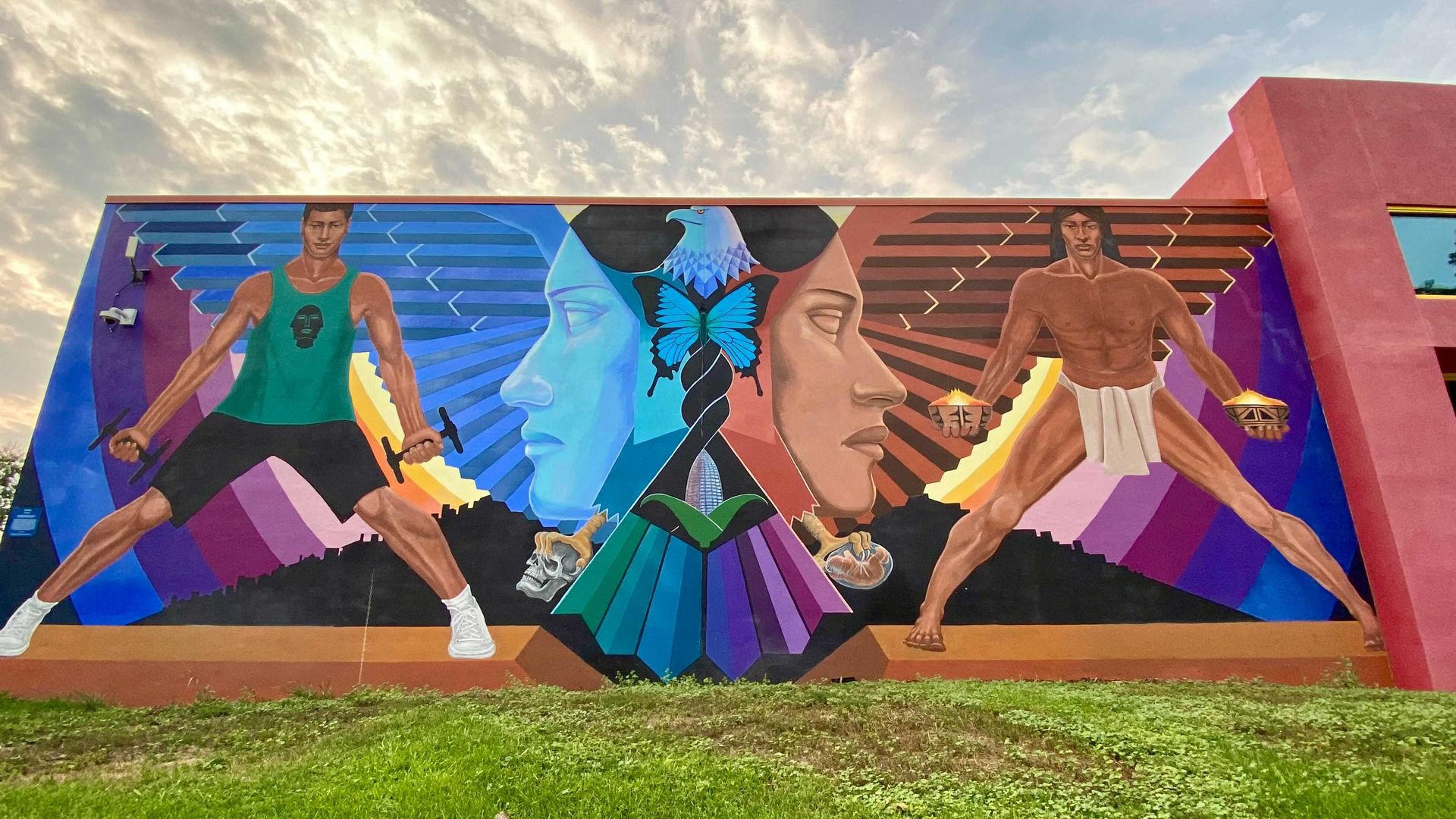 A photo of a large mural painted on a wall at the La Alma Recreation Center.