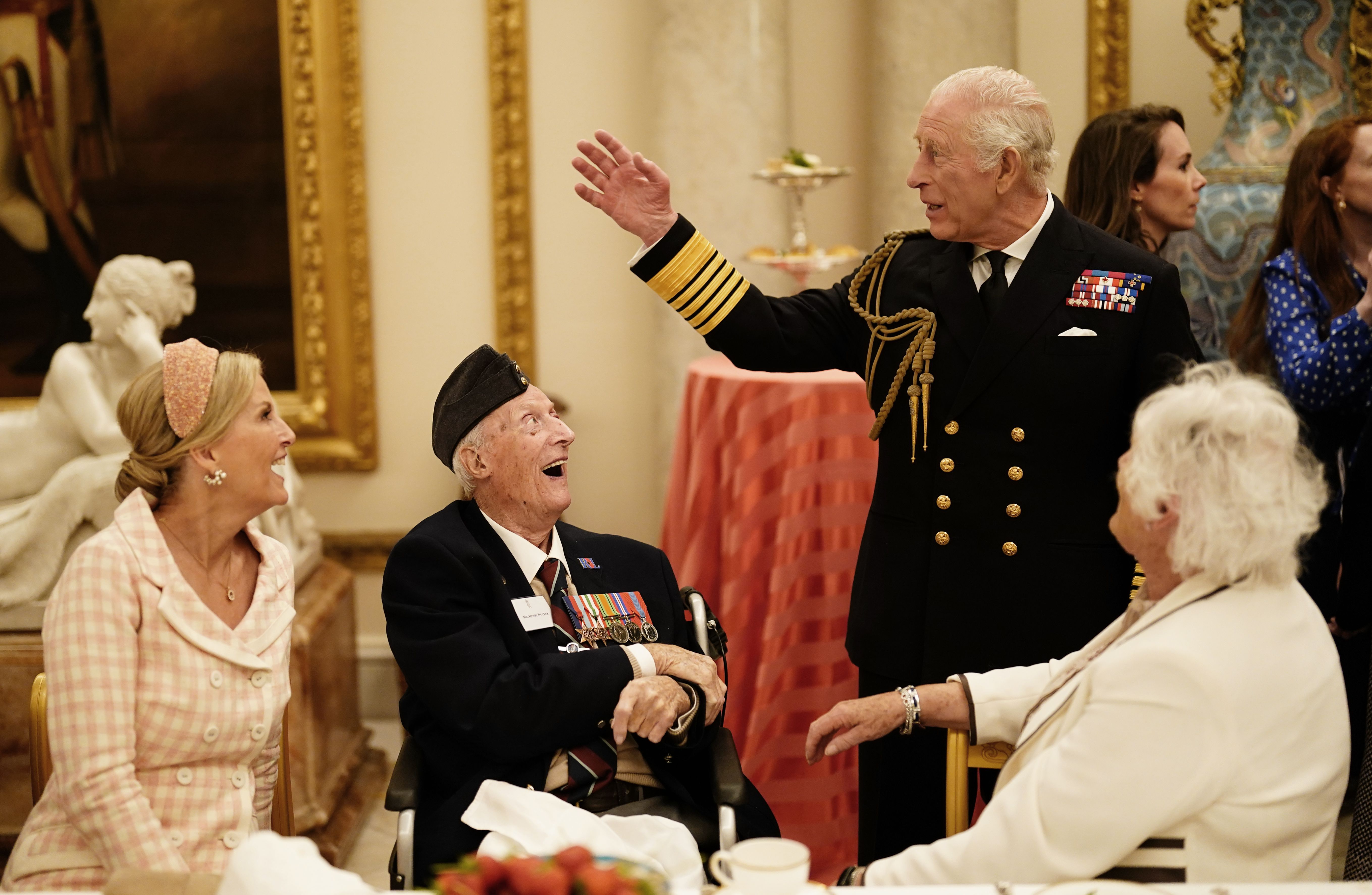 LONDON, ENGLAND - MAY 5: Sophie, Duchess of Edinburgh and King Charles III join Second World War veterans at a tea party in Buckingham Palace following the military procession to mark the 80th anniversary of VE Day on May 5, 2025 in London, England. The King and Queen, joined by Members of the Royal